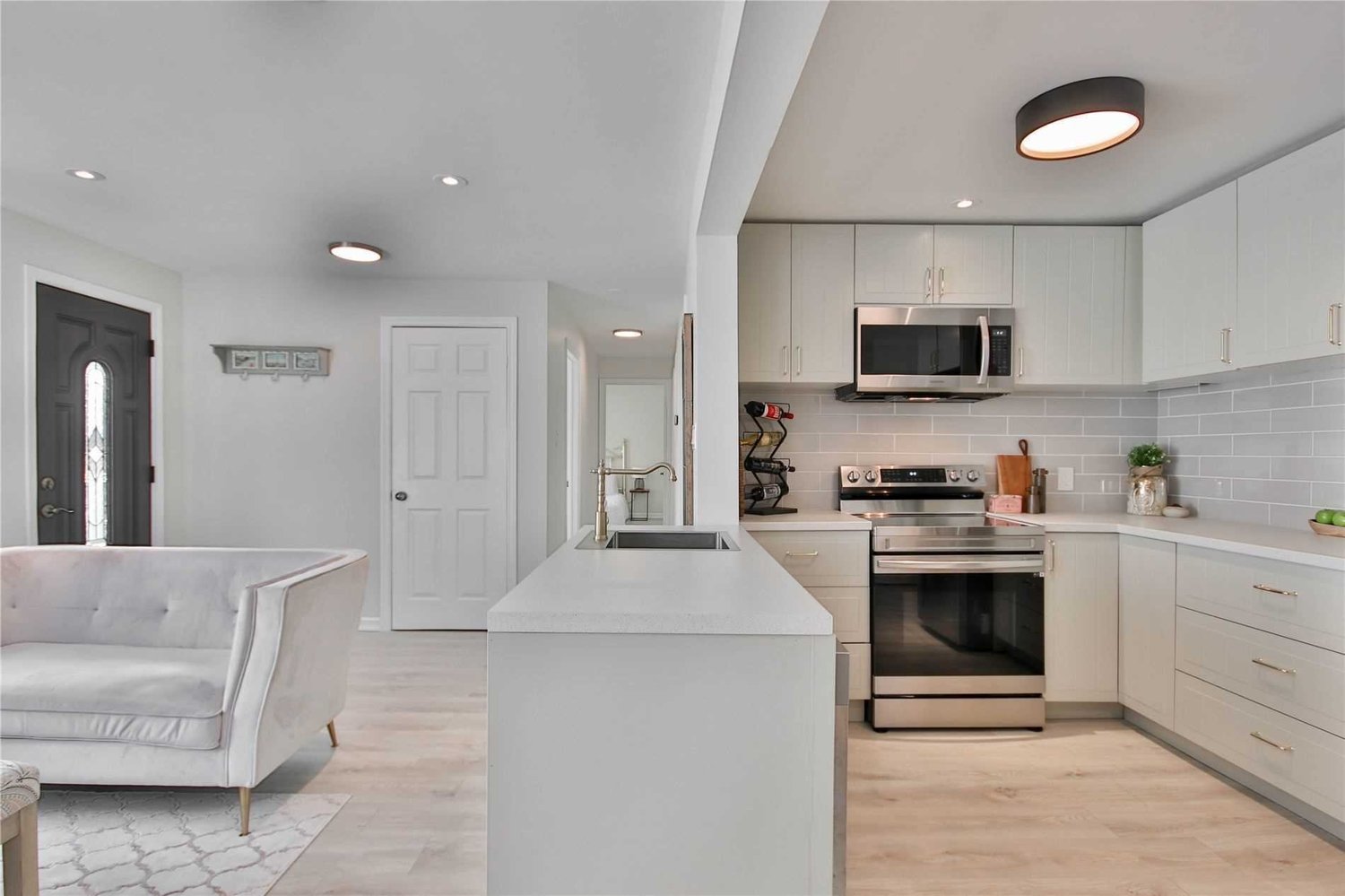 Open-concept kitchen and living area, Project Queensway