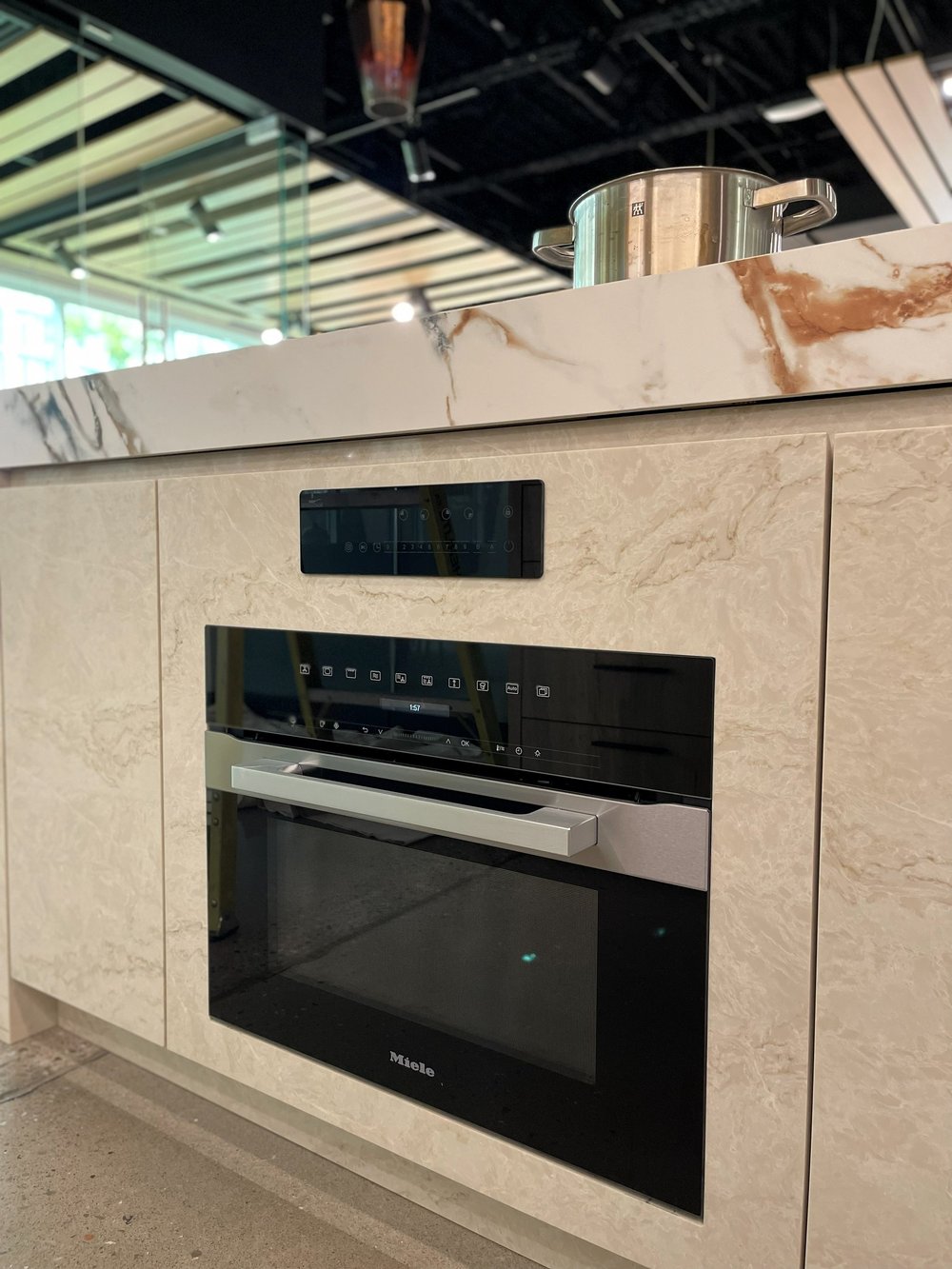 Built-in oven set into a stone display island at the Caesarstone showroom