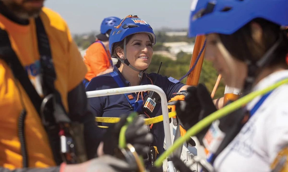 Community member participating in Over the Edge