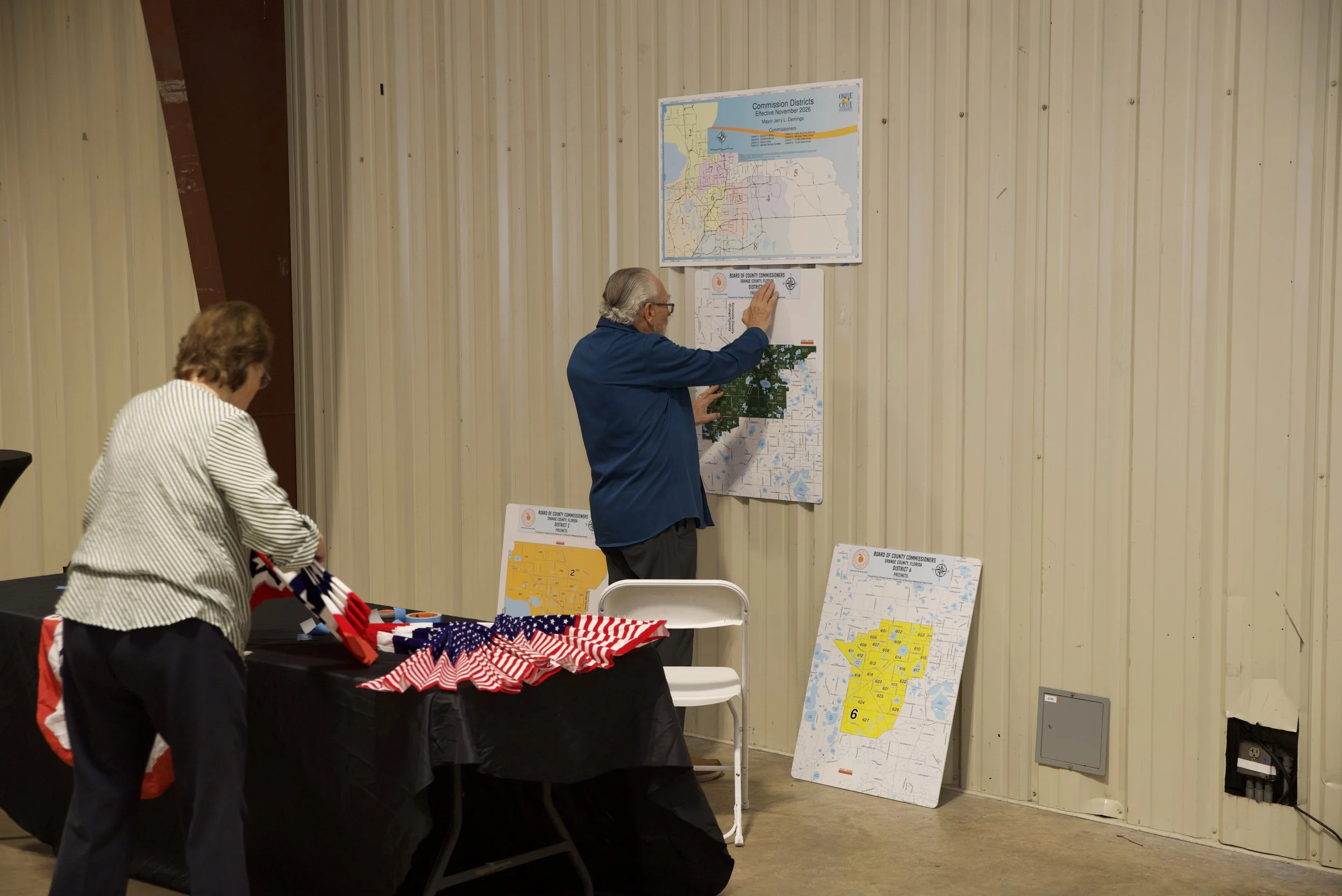 PHCC volunteers setting up maps for residents