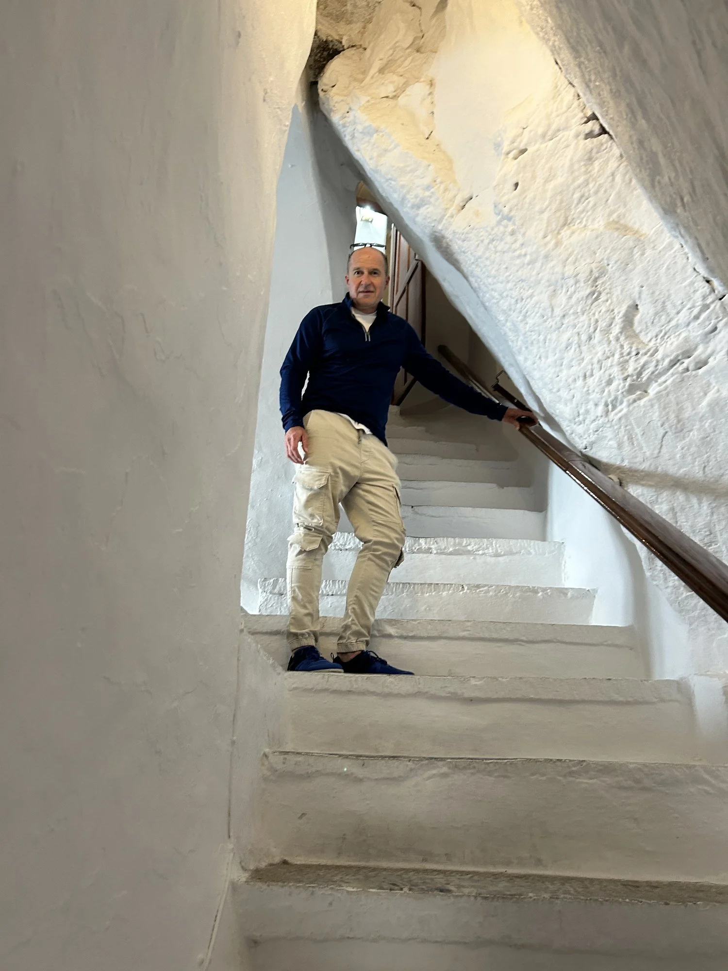 White monastery staircase carved into the cliffs of Amorgos