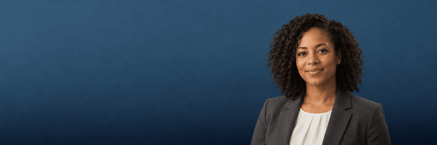 Law firm headshot on a navy backdrop, photographed by Brett Harkness