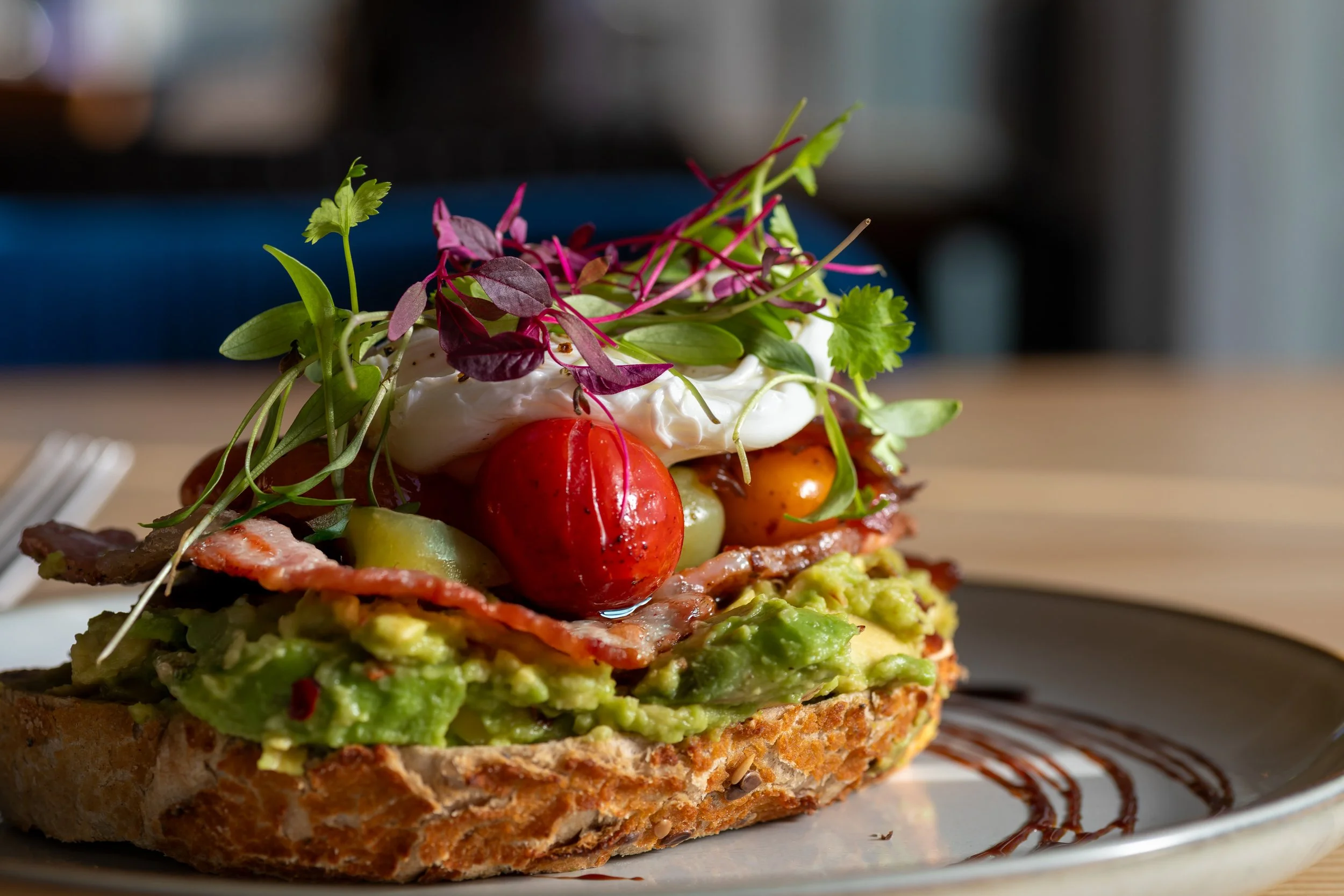 Smashed avocado and poached eggs on sourdough toast at The Folly Wine Bar Petersfield