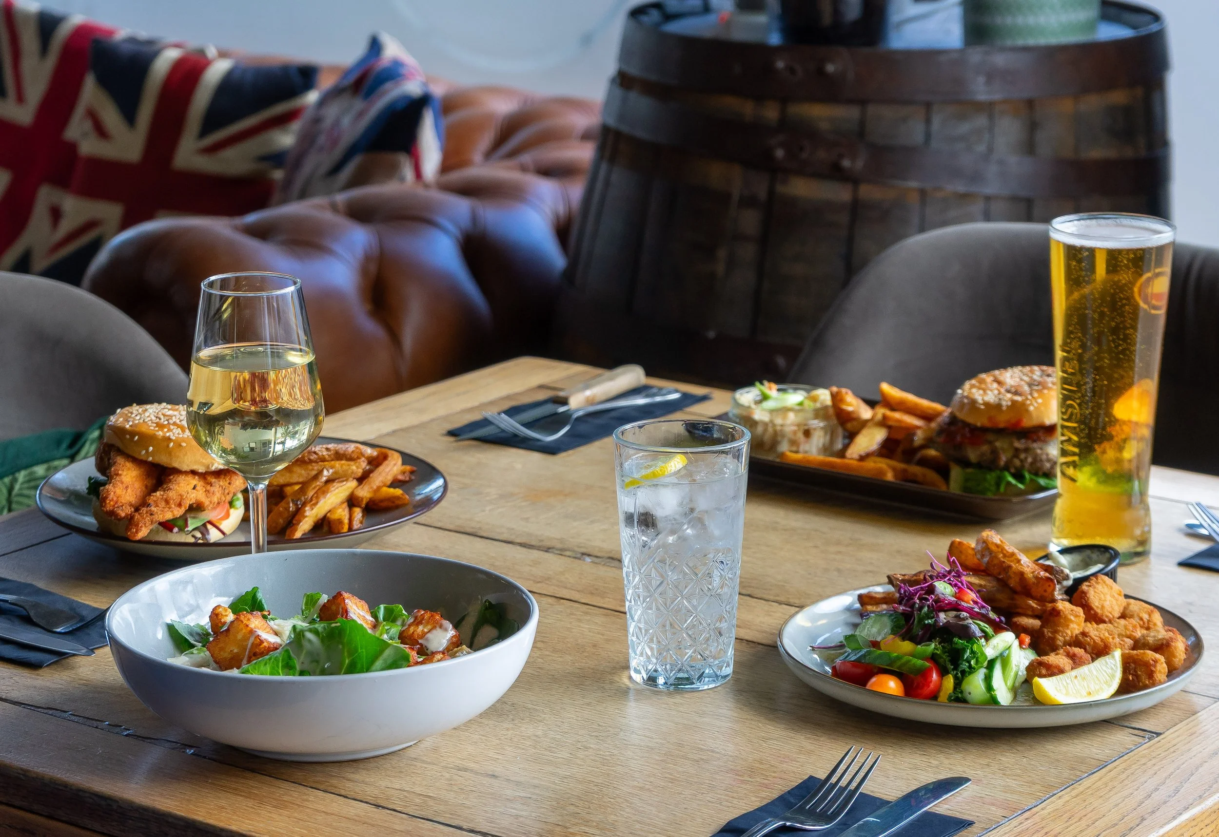 Table with lunch dishes and drinks at The Folly Wine Bar Petersfield