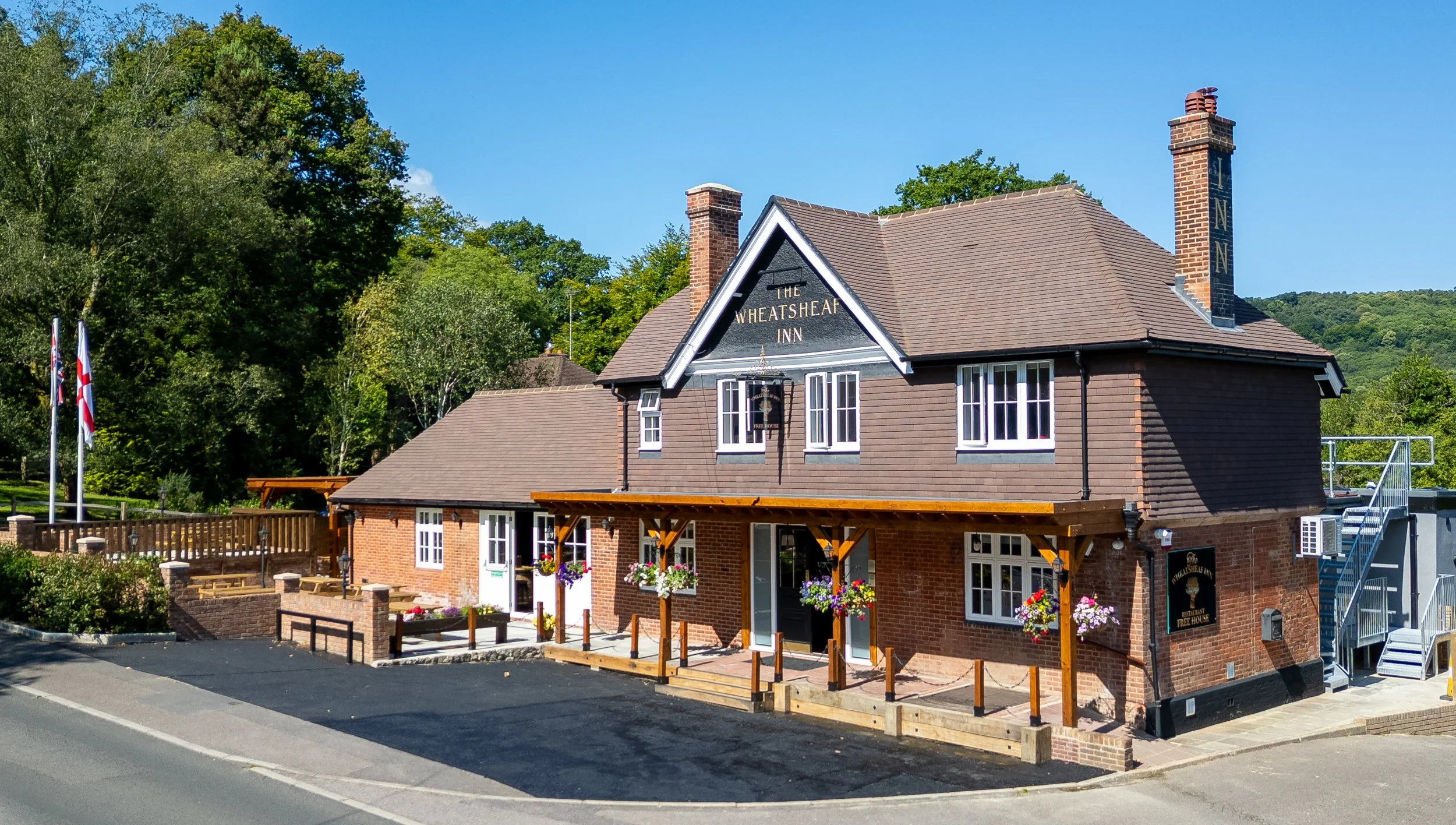 Low-level drone shot of The Wheatsheaf Inn Grayswood Surrey