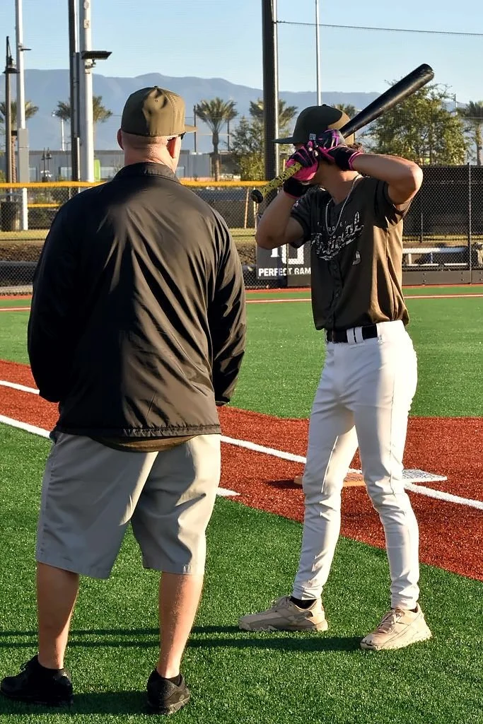 Coach working with a hitter