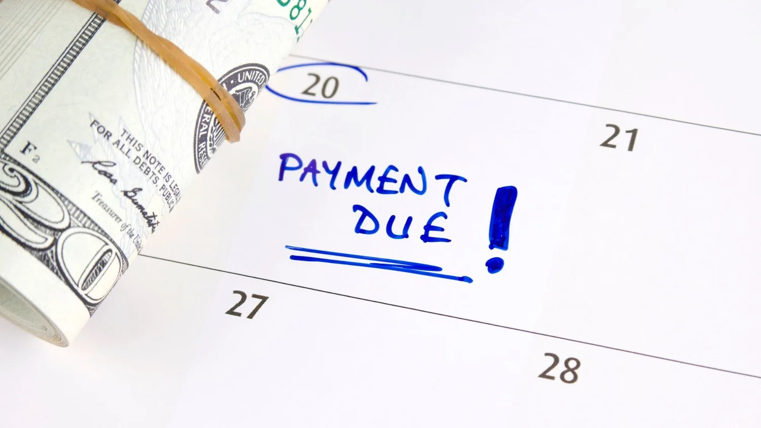 Calendar marked Payment Due beside a roll of cash, illustrating on-time rent collection