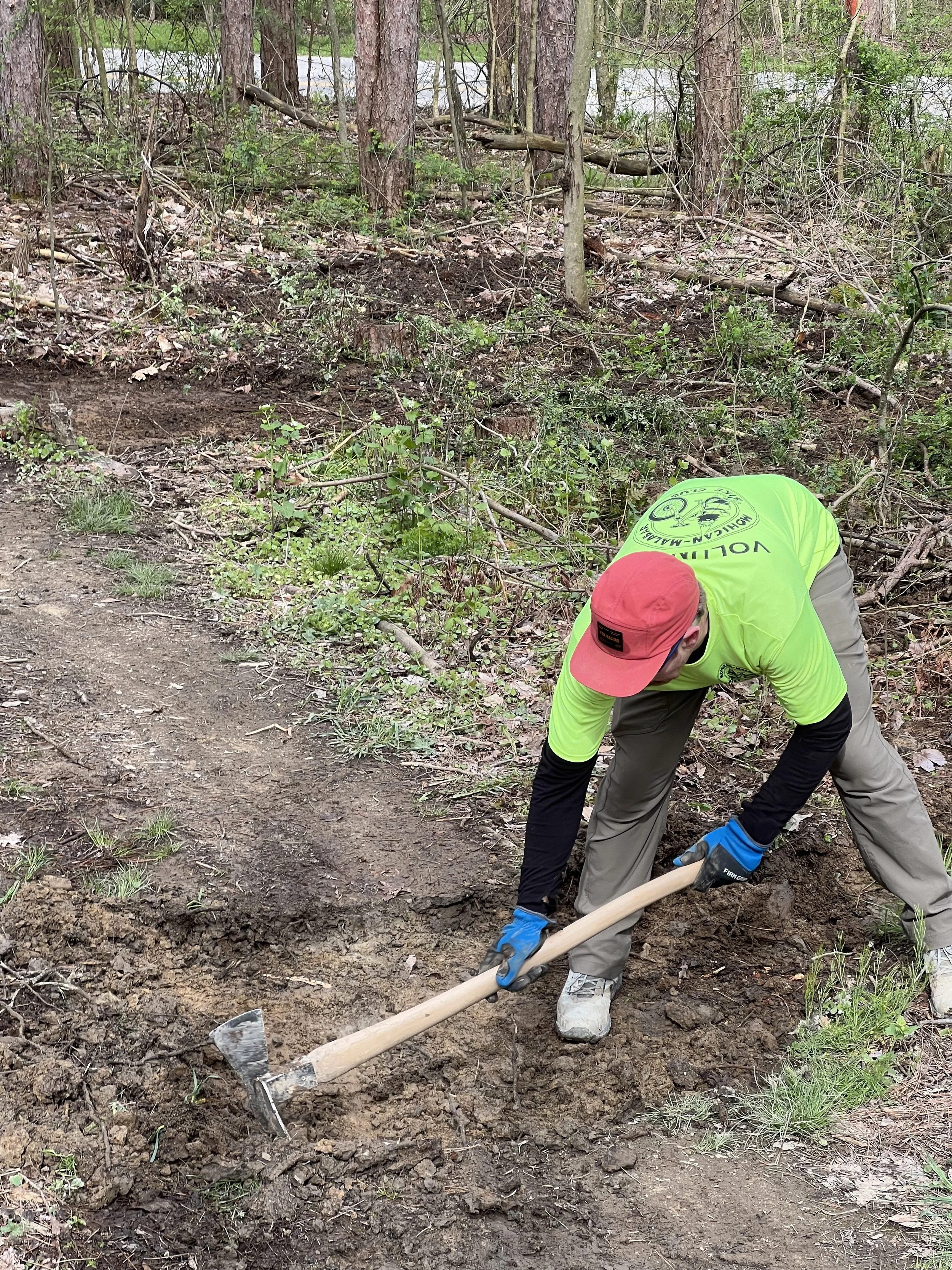 Volunteer using trail tools
