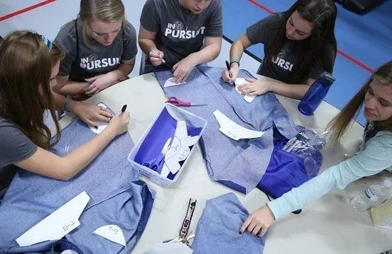 People gathered for a Sole Hope Shoe Cutting Party