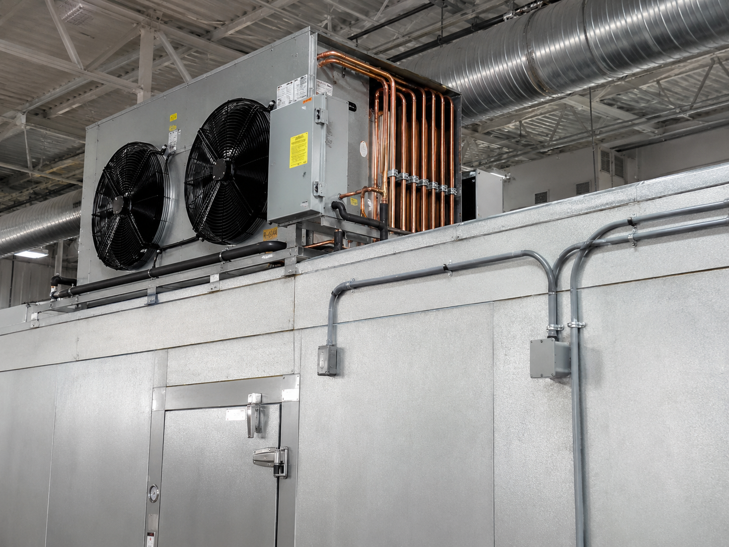 Refrigeration condensing unit for a commercial display cooler installation
