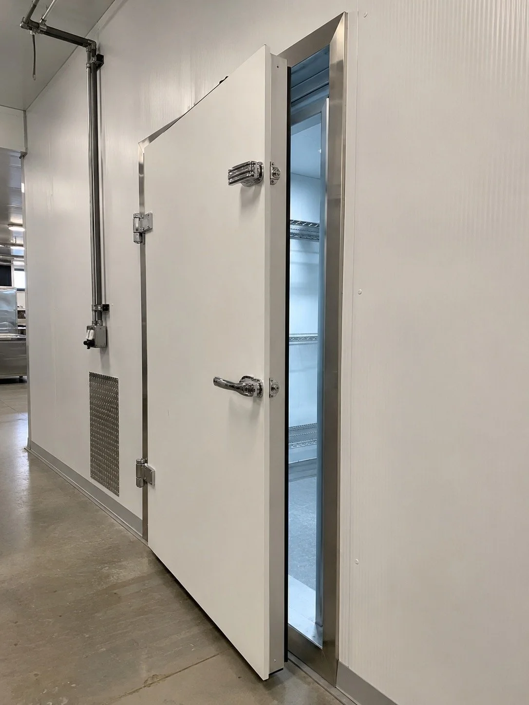 Walk-in cooler door installation by Titan Walk-In Coolers