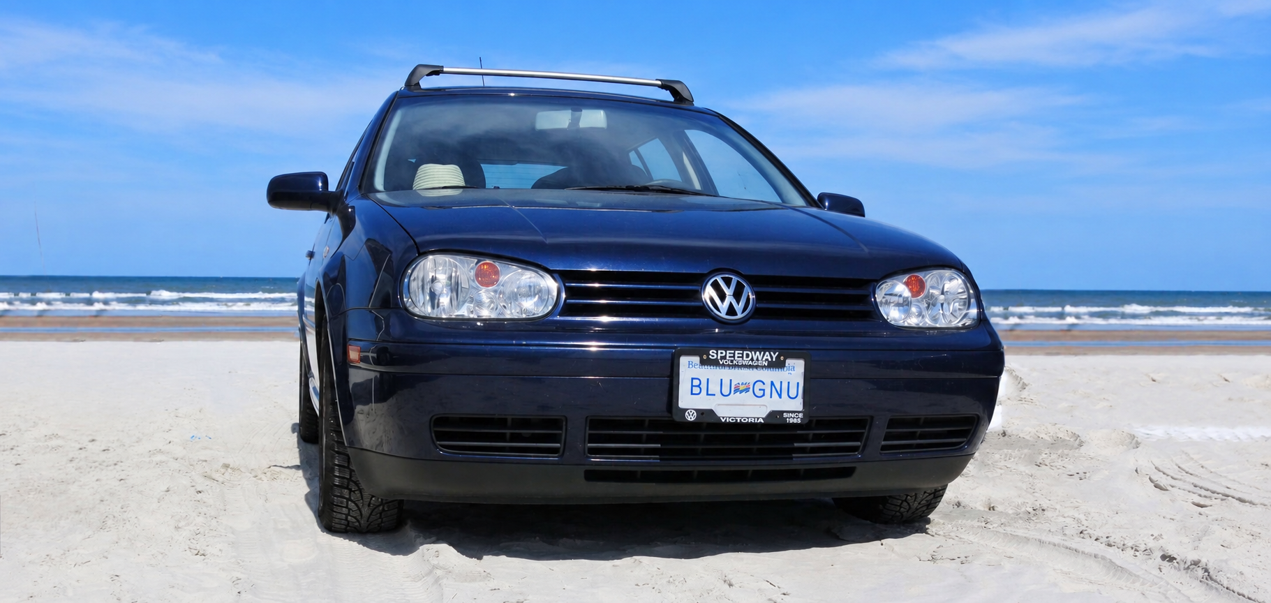 Blue Gnu recreational vehicle on a coastal road
