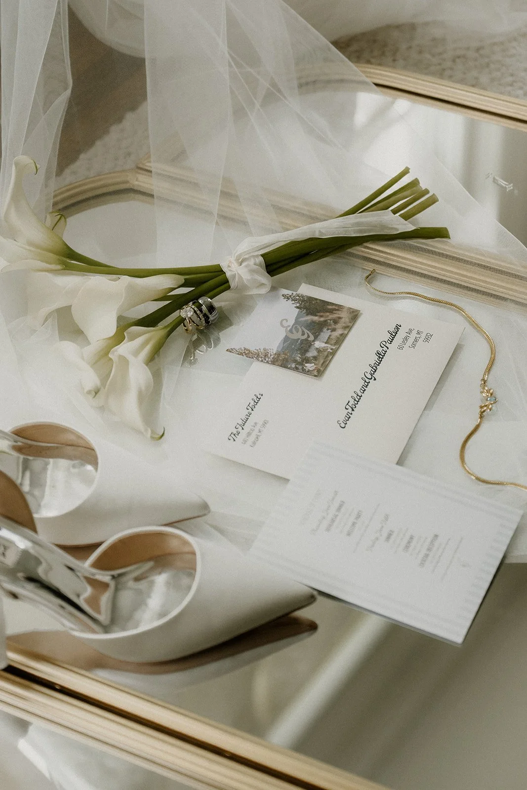 Wedding invitation and ring details at a Montana elopement