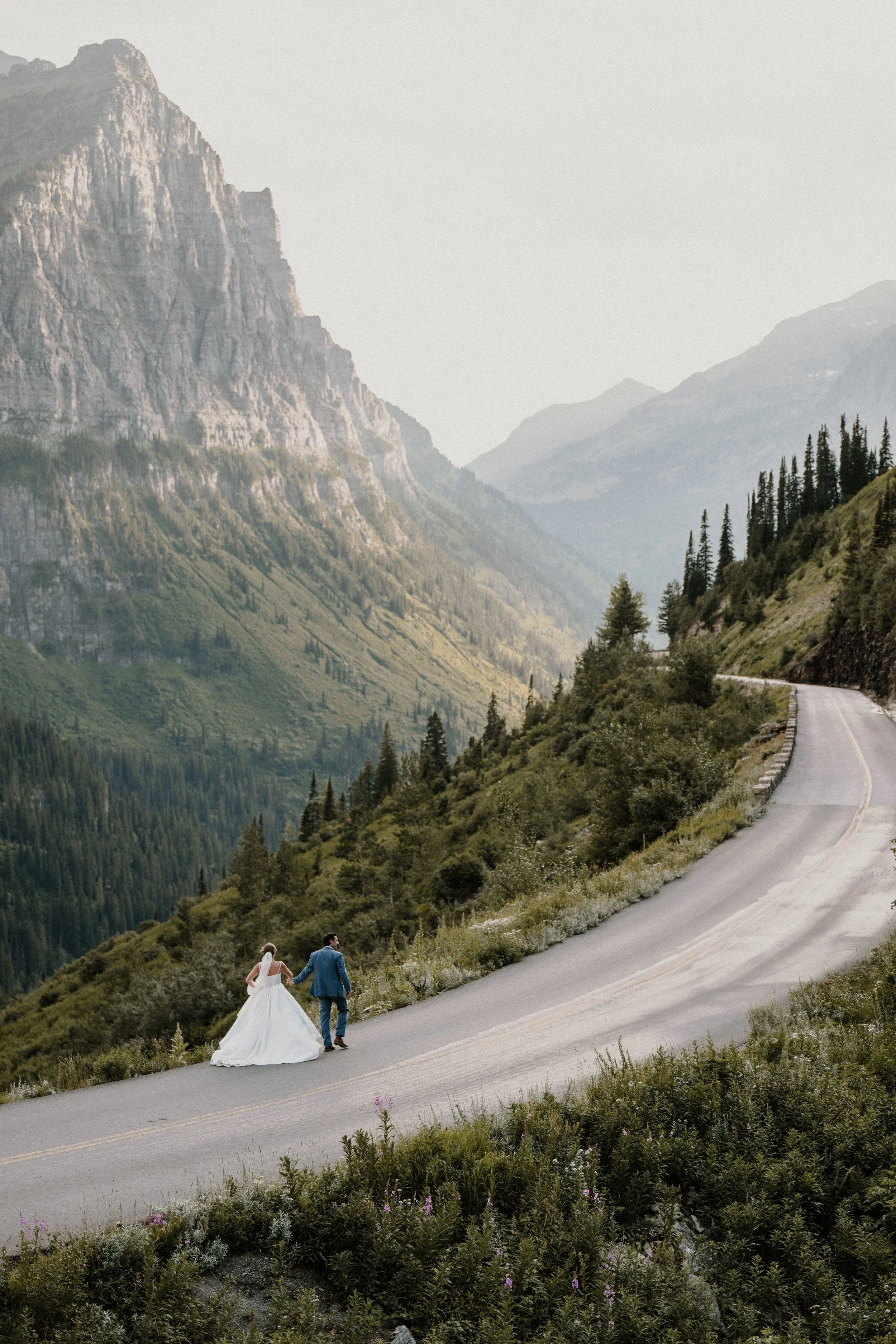 Private vow exchange between two people in Glacier National Park