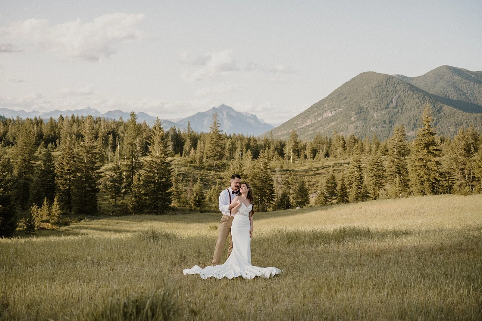 Couple exchanging vows with a mountain backdrop during a Glacier elopement