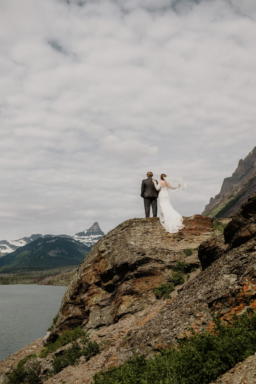 Maddie and Clay with the peaks of Glacier National Park behind them