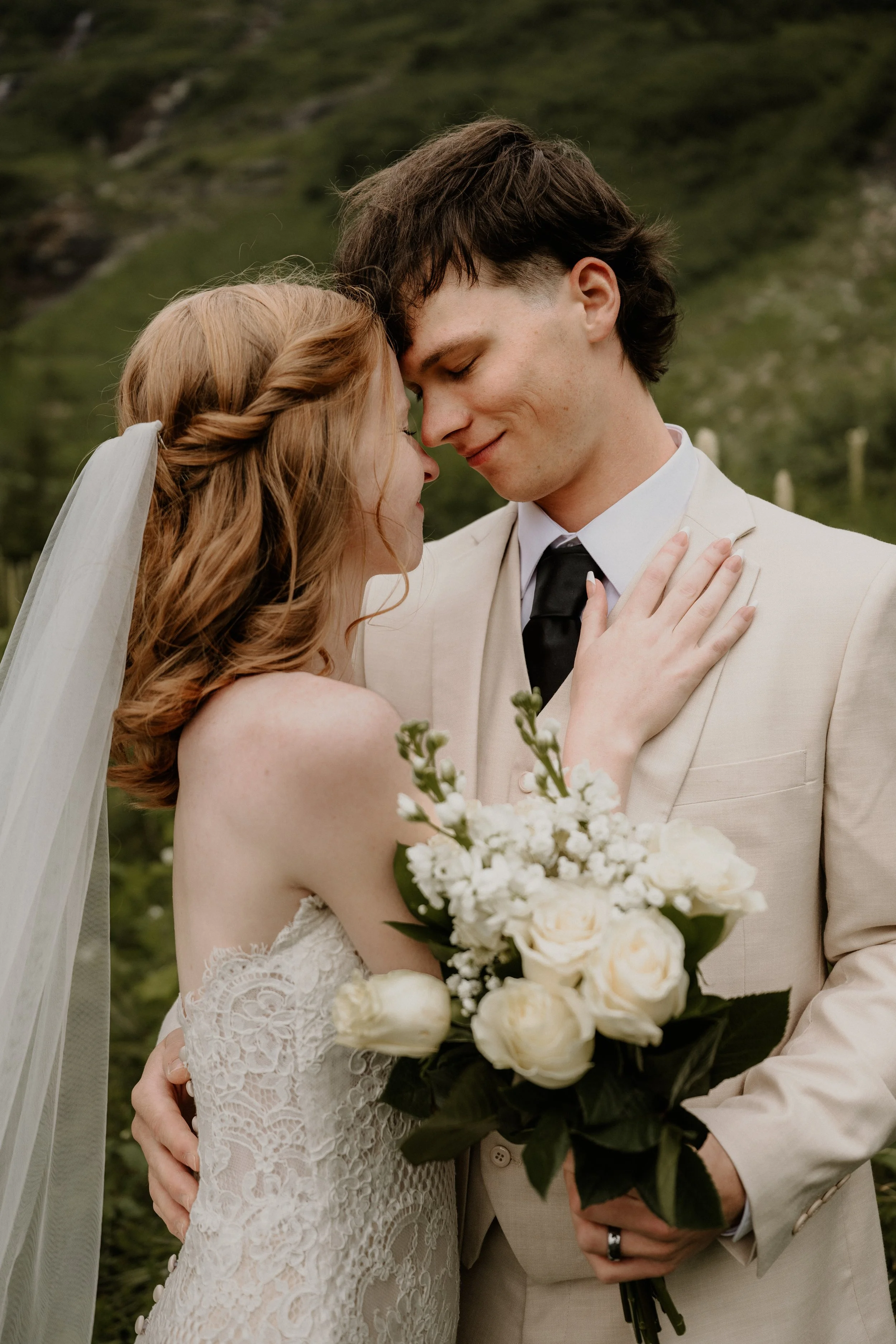 Wedding couple in wildflowers near Logan Pass, Glacier National Park