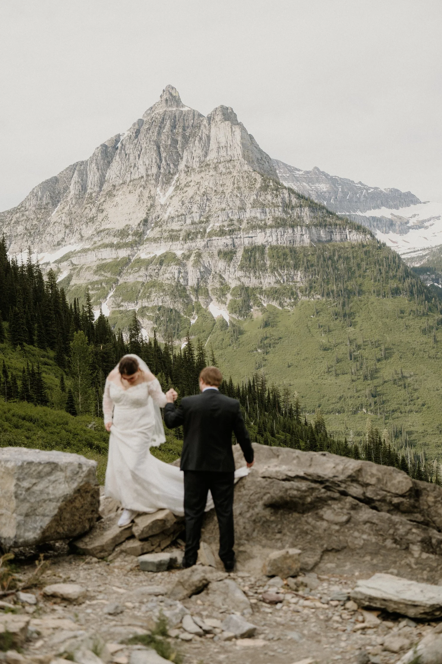 Maddie and Clay exchanging vows in the cedar grove at Avalanche Picnic Area