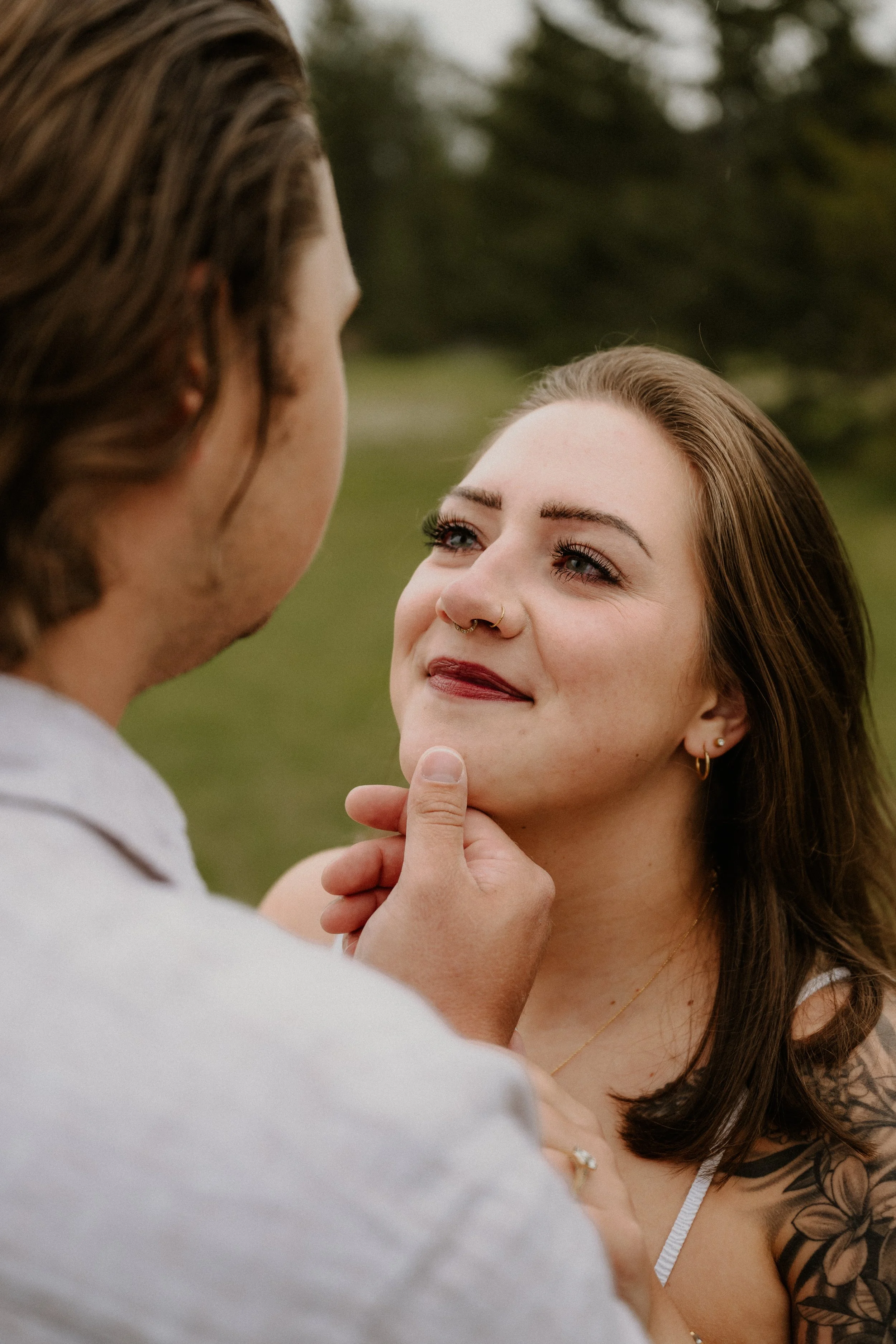 Moody overcast engagement portraits at Lake McDonald in Glacier National Park Montana