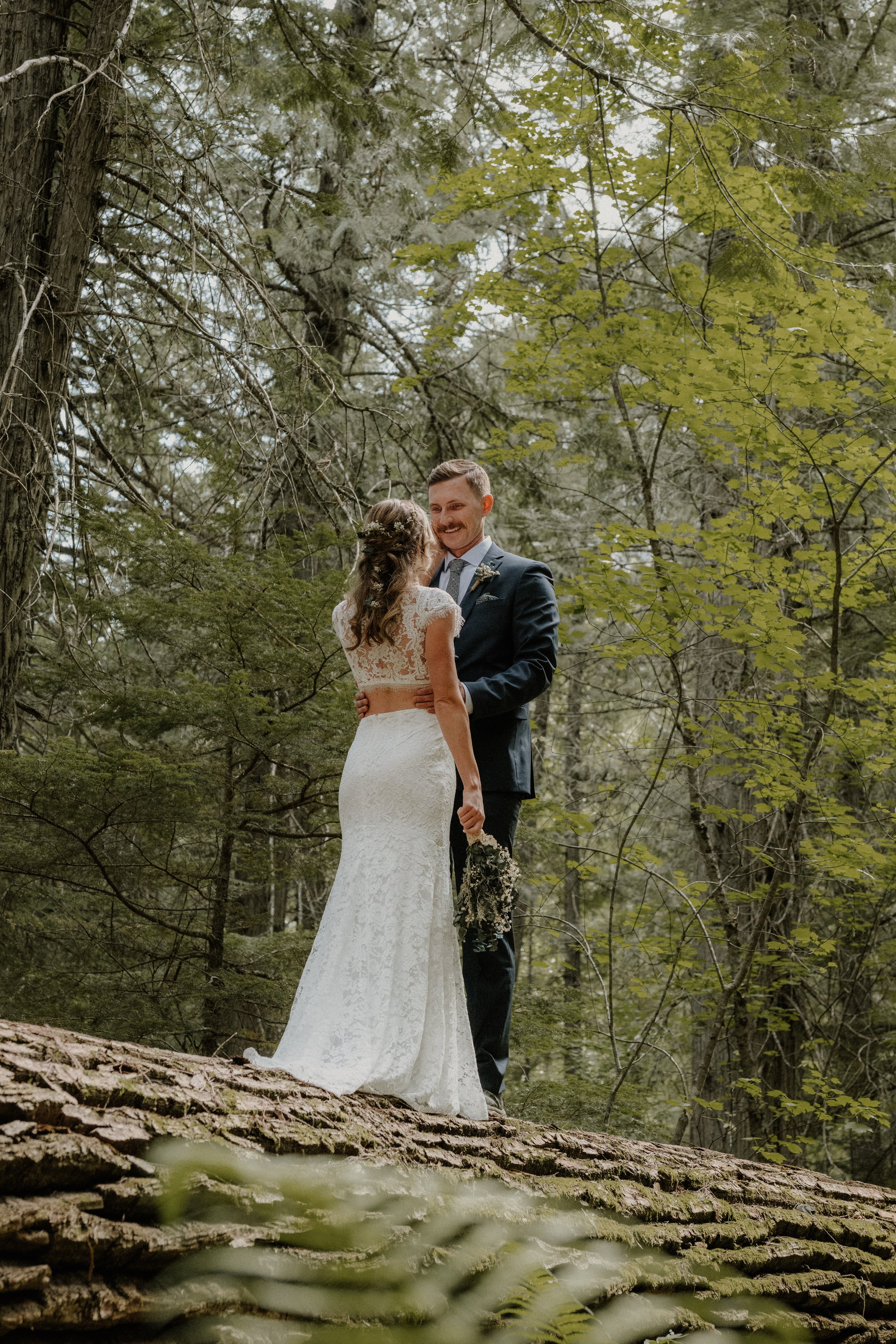 Couple eloping at Avalanche Lake in Glacier National Park