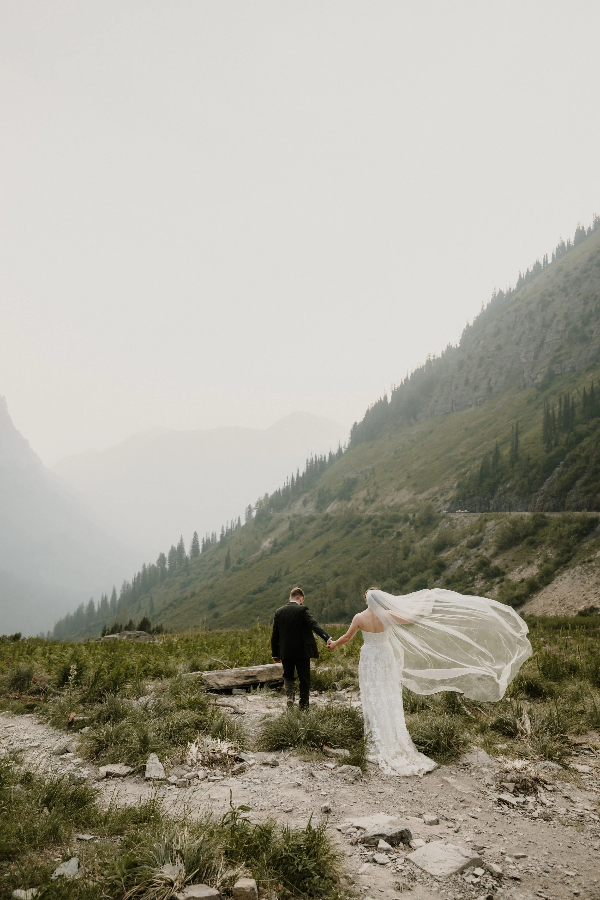 Big Bend elopement portraits in Glacier National Park below Logan Pass