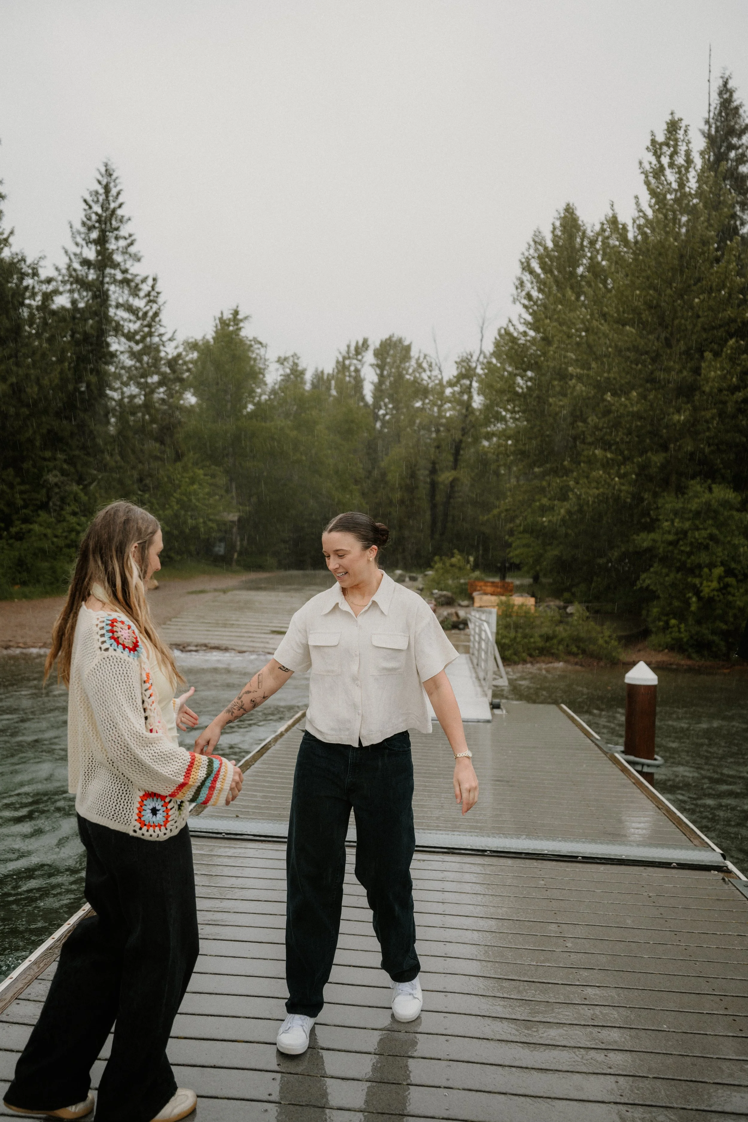 Taylor and Whitney embracing at Lake McDonald after the proposal