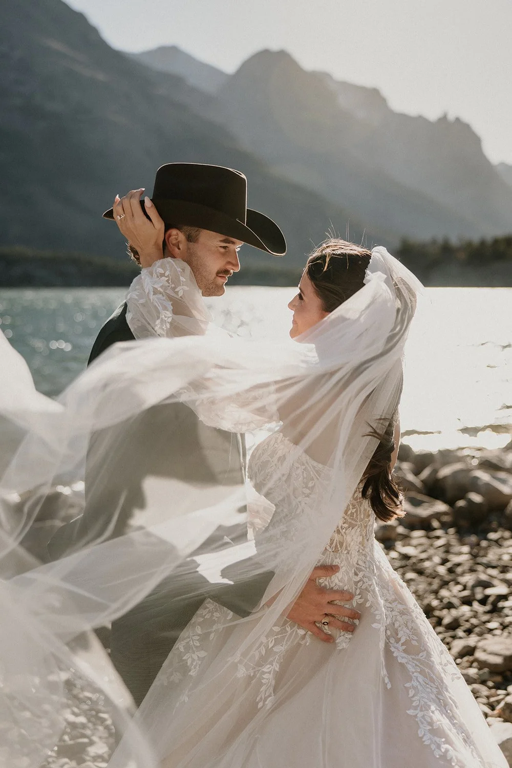 Glacier National Park elopement couple embracing during golden hour