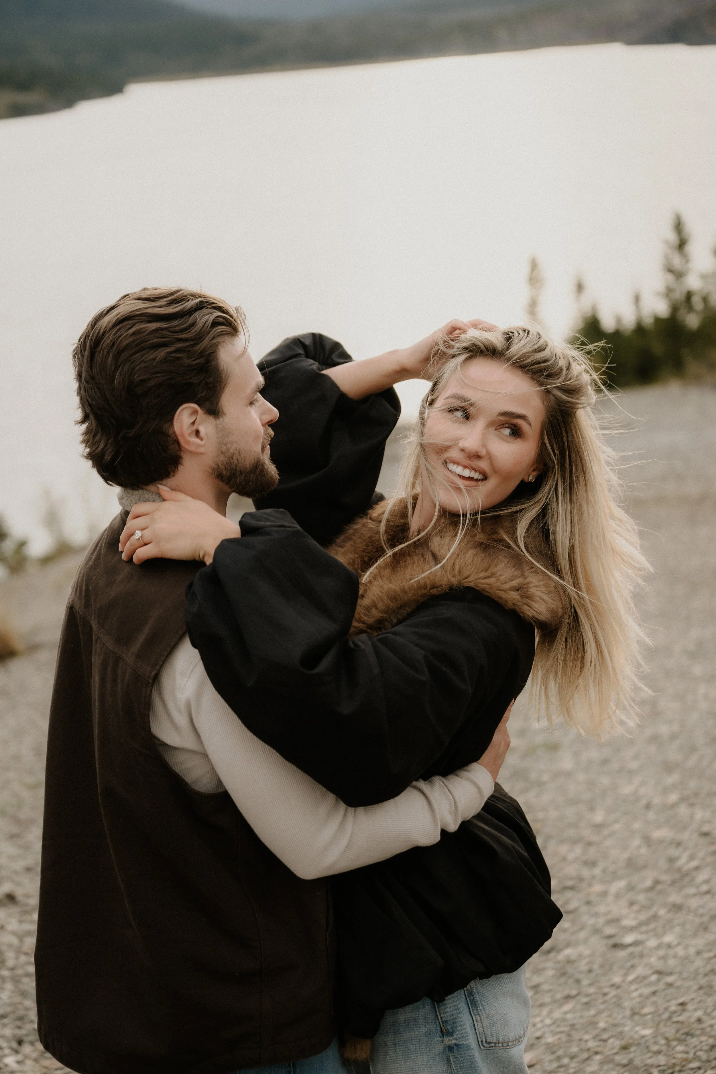 Surprise proposal photographer in Glacier National Park at Sun Point