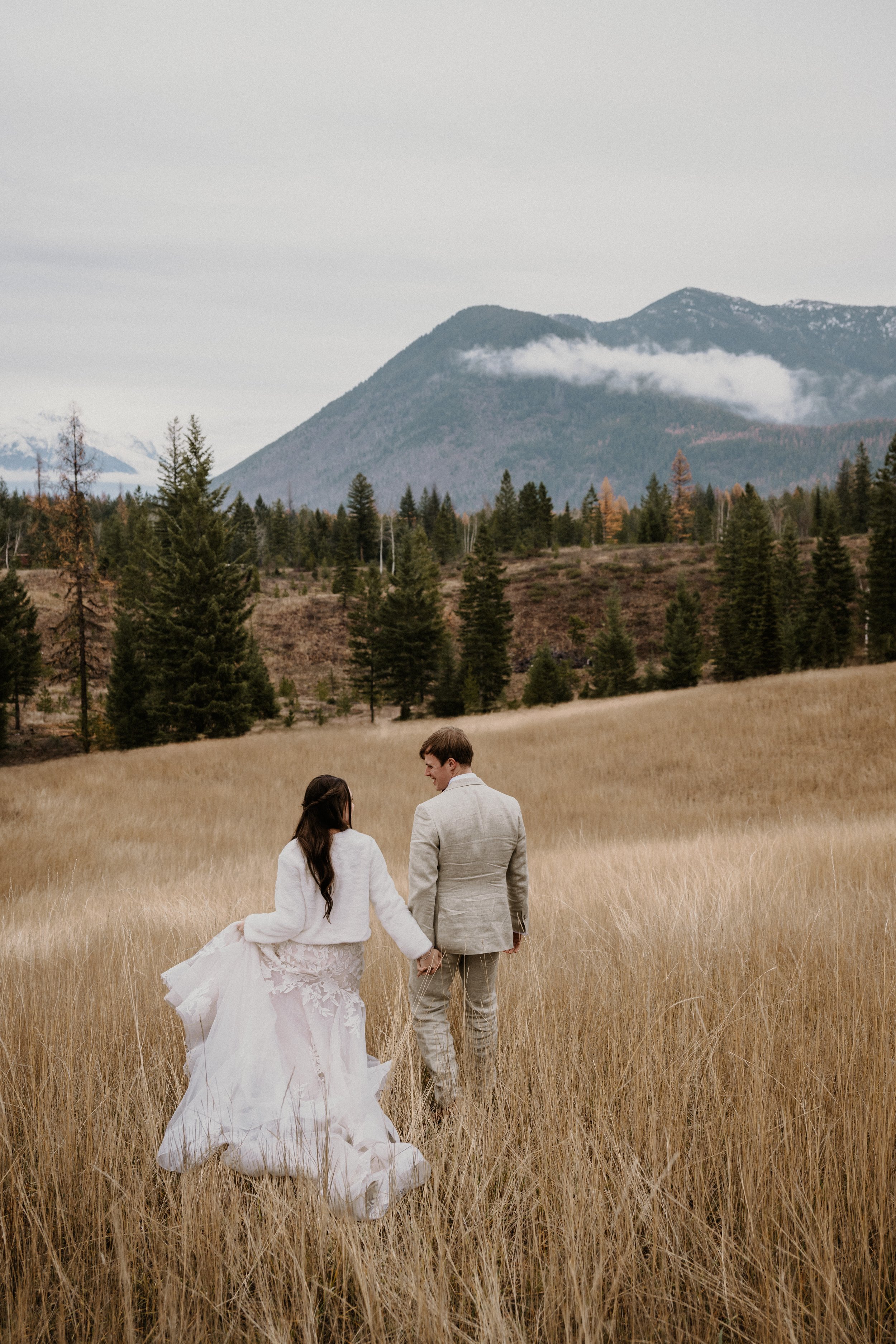 Couple eloping in the snow in Glacier National Park, Montana