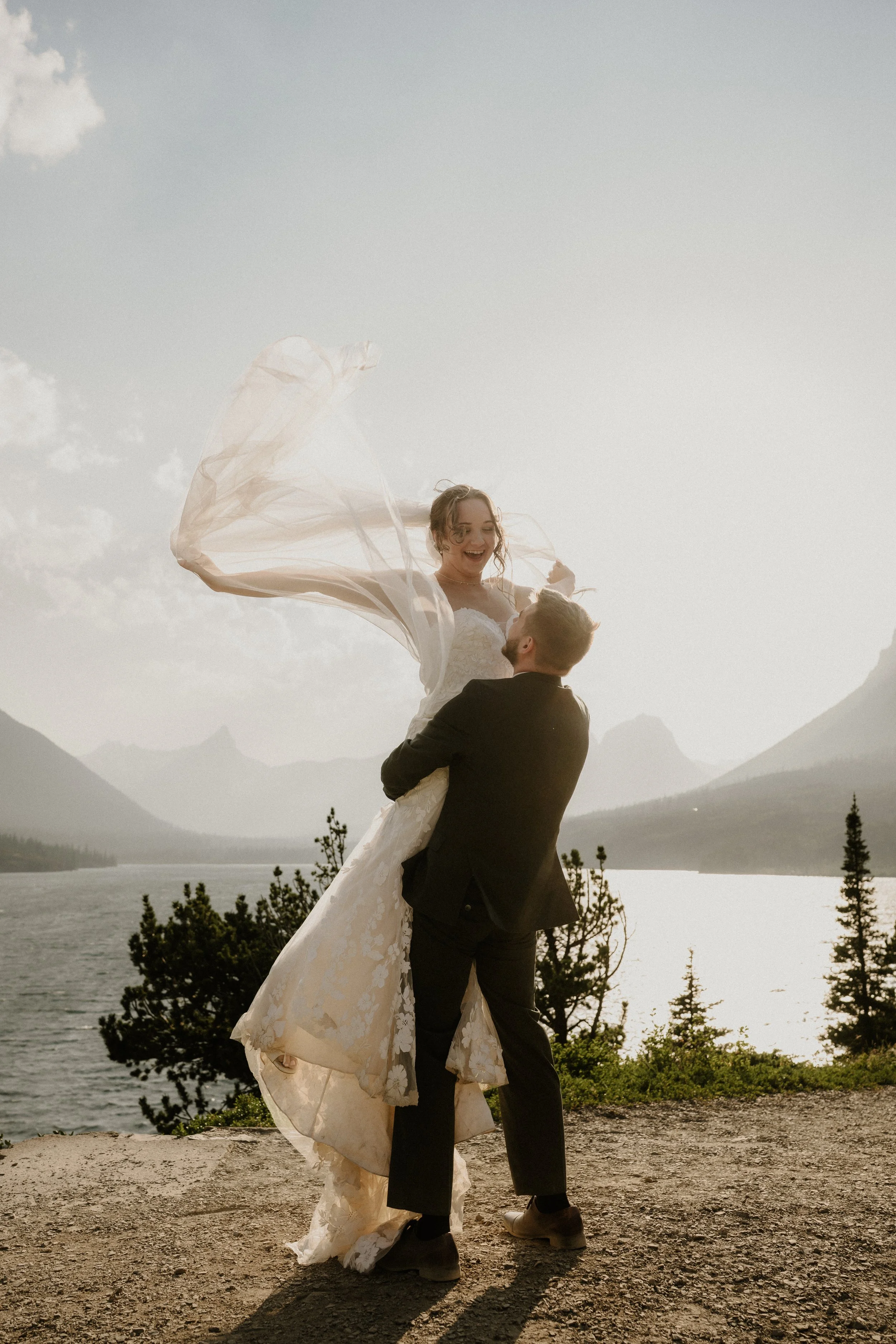 Spring waterfall elopement portraits in Glacier National Park
