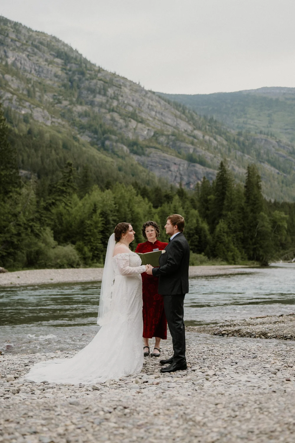 Maddie and Clay laughing together during their Glacier elopement portraits