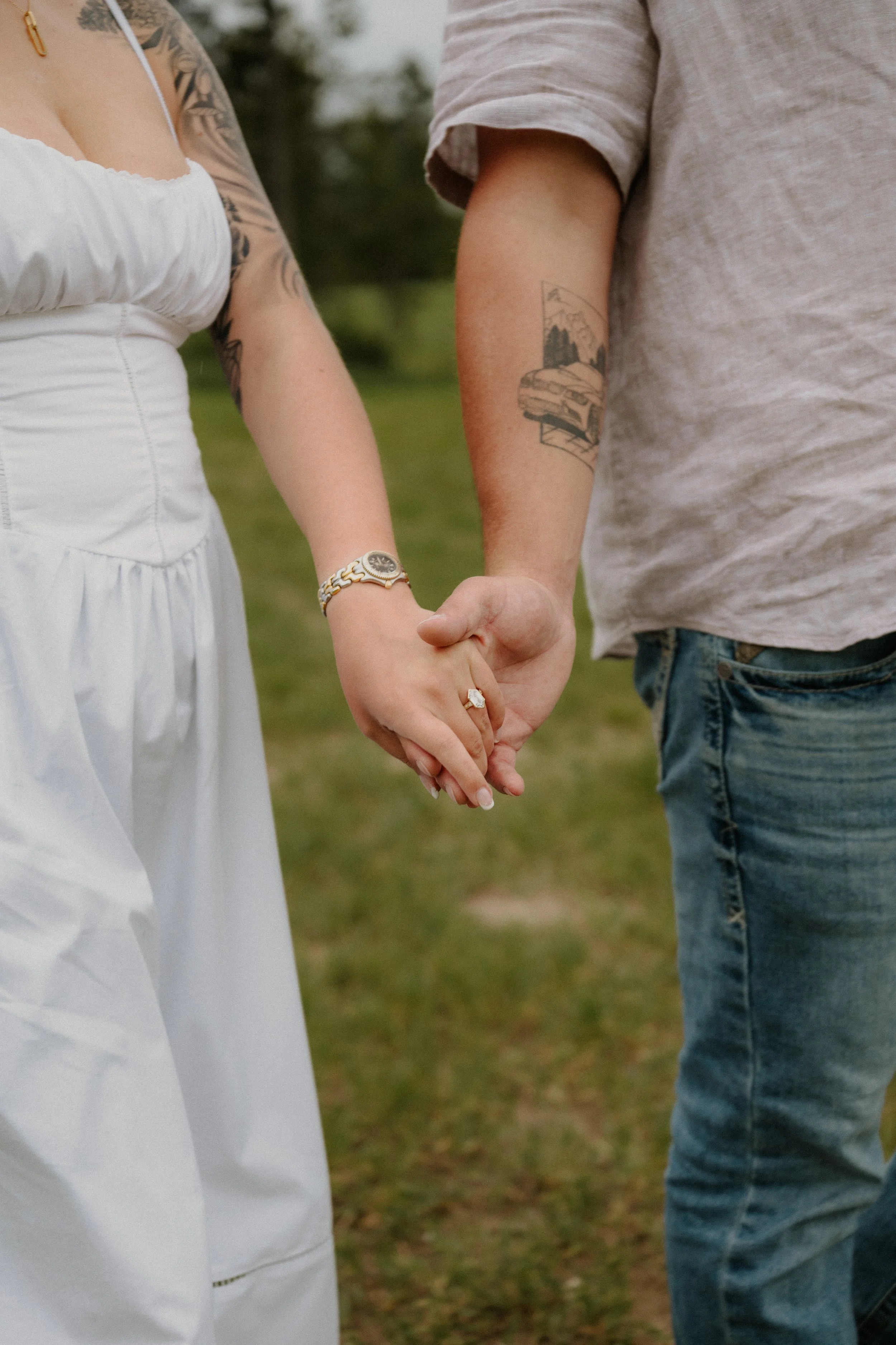 Intimate engagement portraits among the trees in West Glacier Montana after a surprise proposal