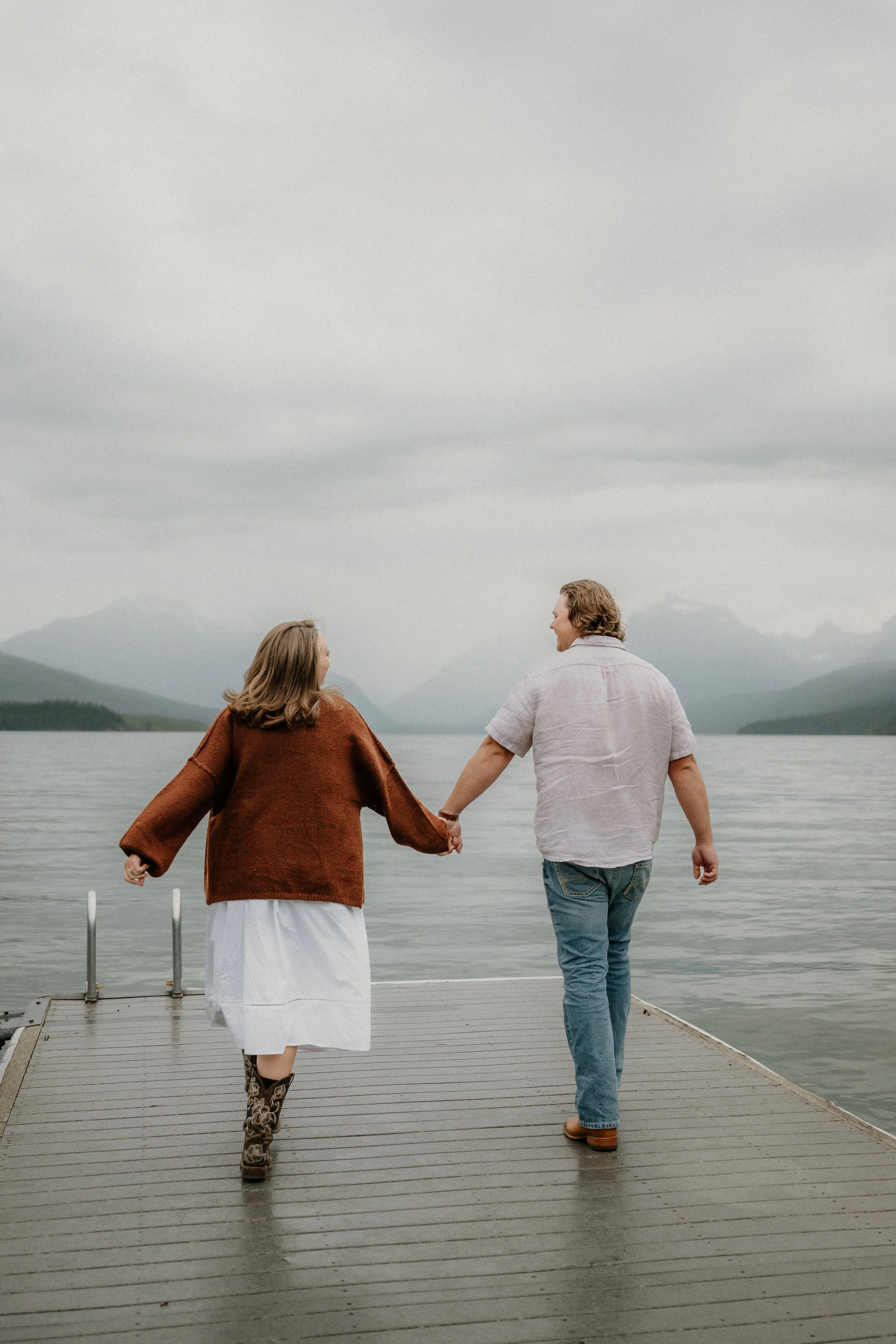 Jenica saying yes during a surprise proposal at Lake McDonald in West Glacier Montana