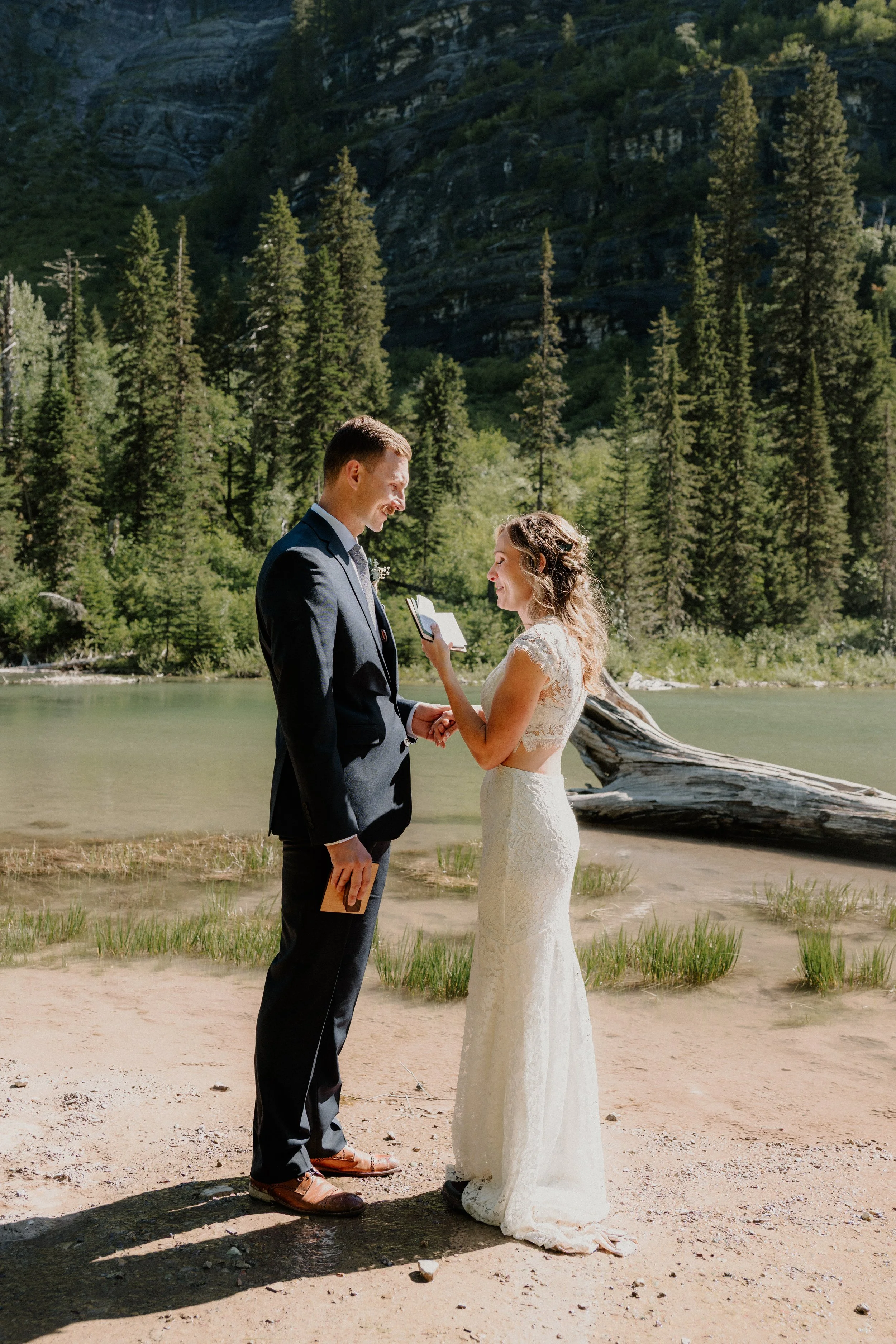 Wedding couple hiking the Avalanche Lake trail in Montana