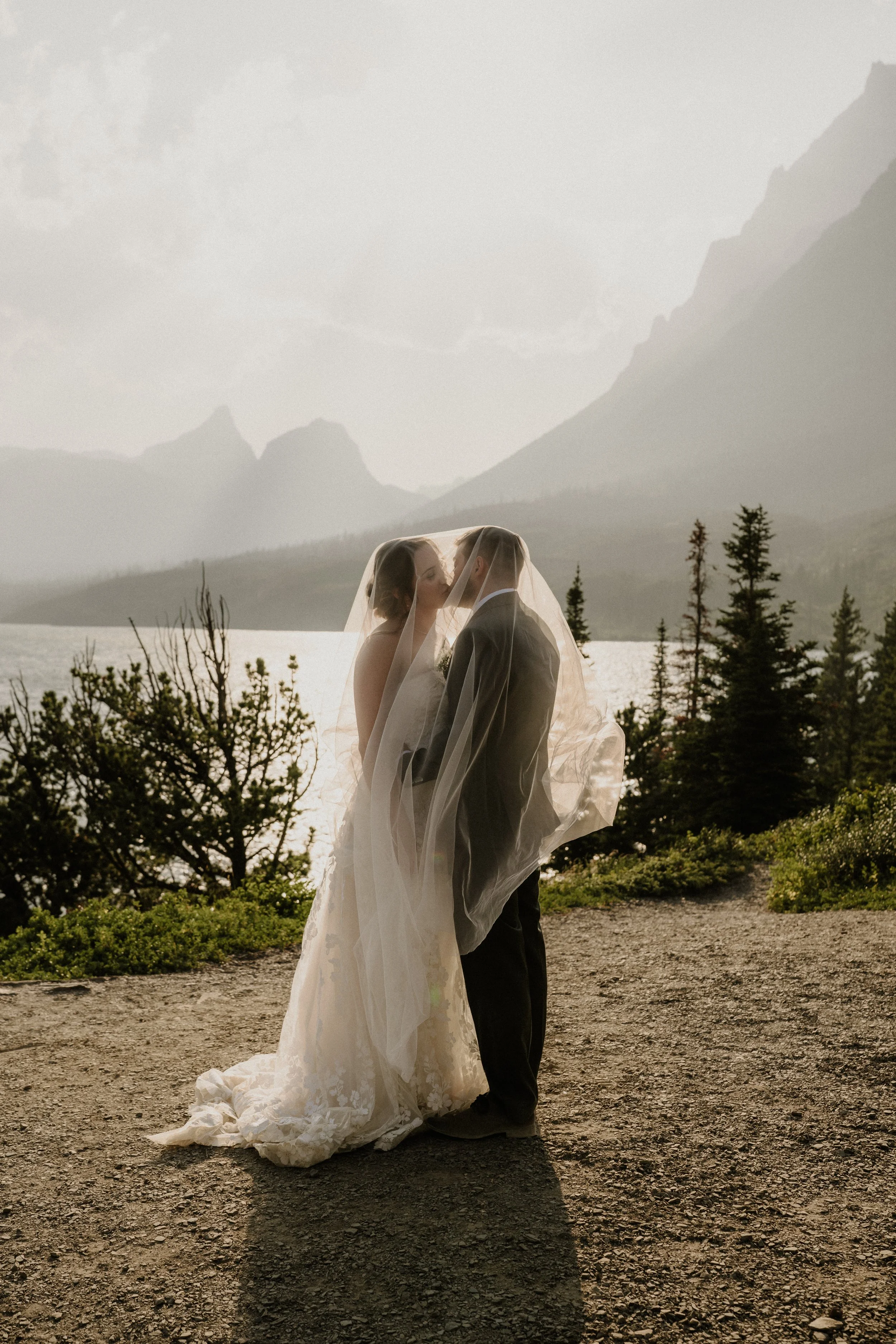 Couple exchanging vows at sunset in Glacier National Park, Montana