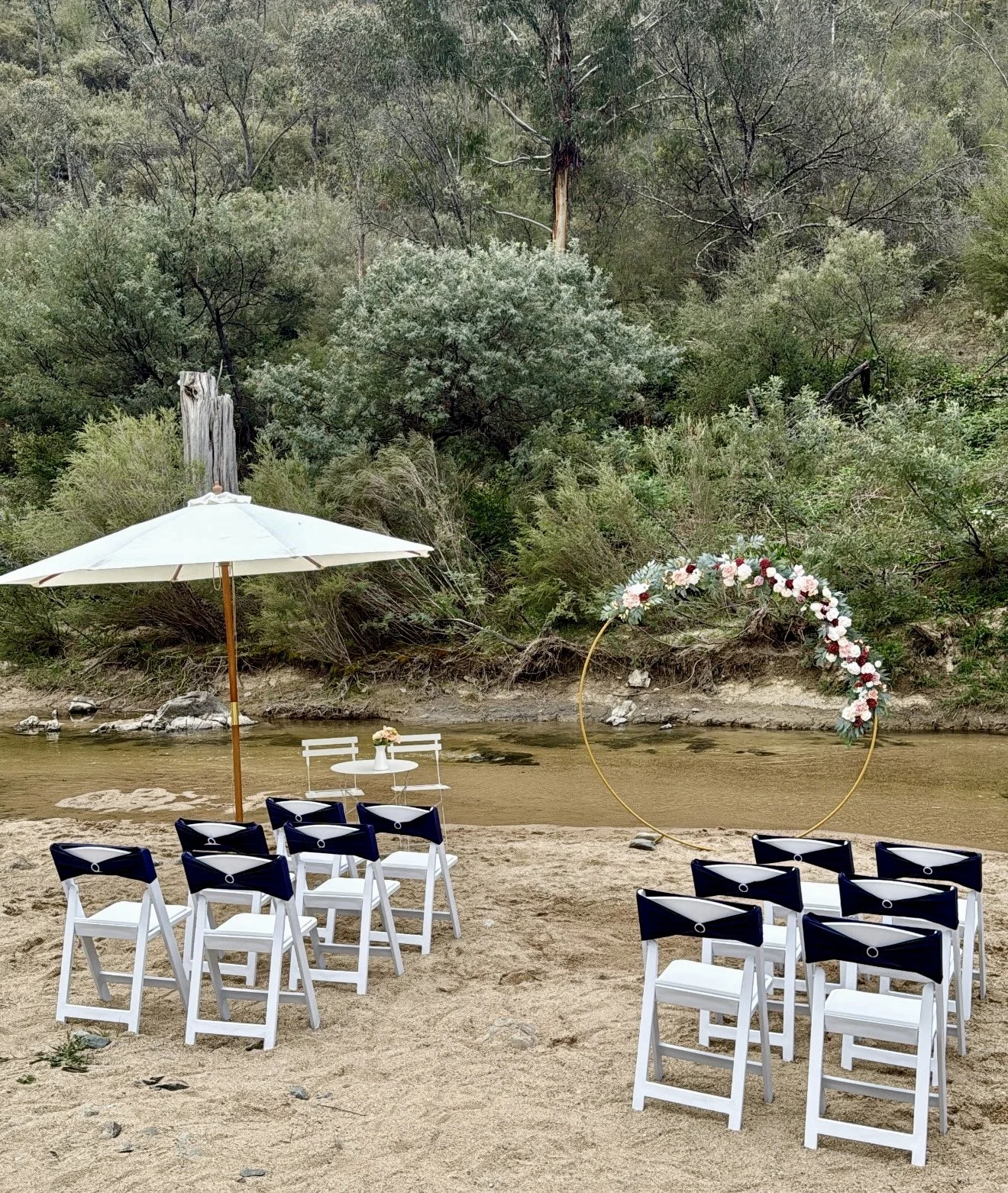 Elopement ceremony setup with chairs and arbour
