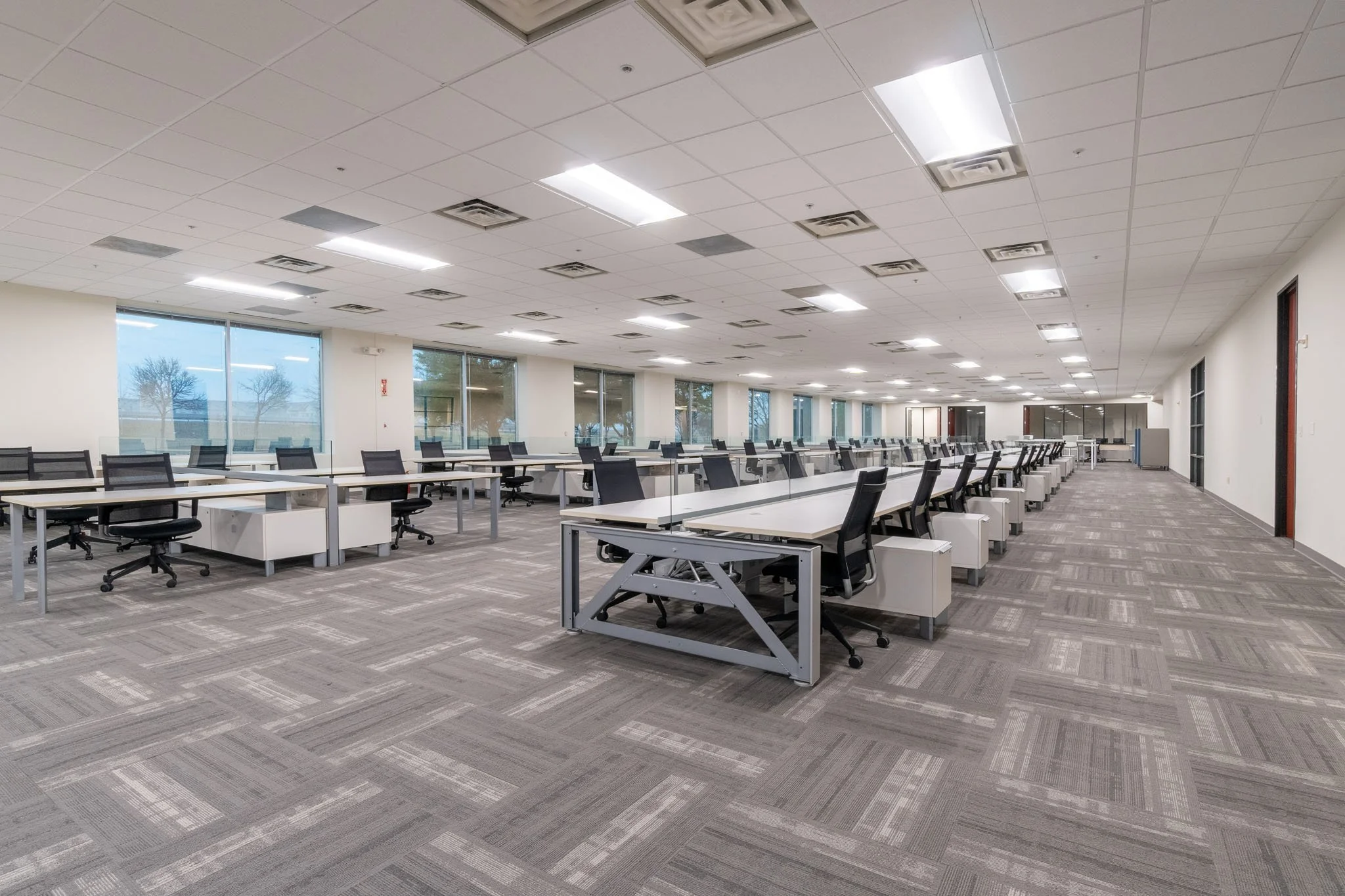 Before: rows of furnished office workstations