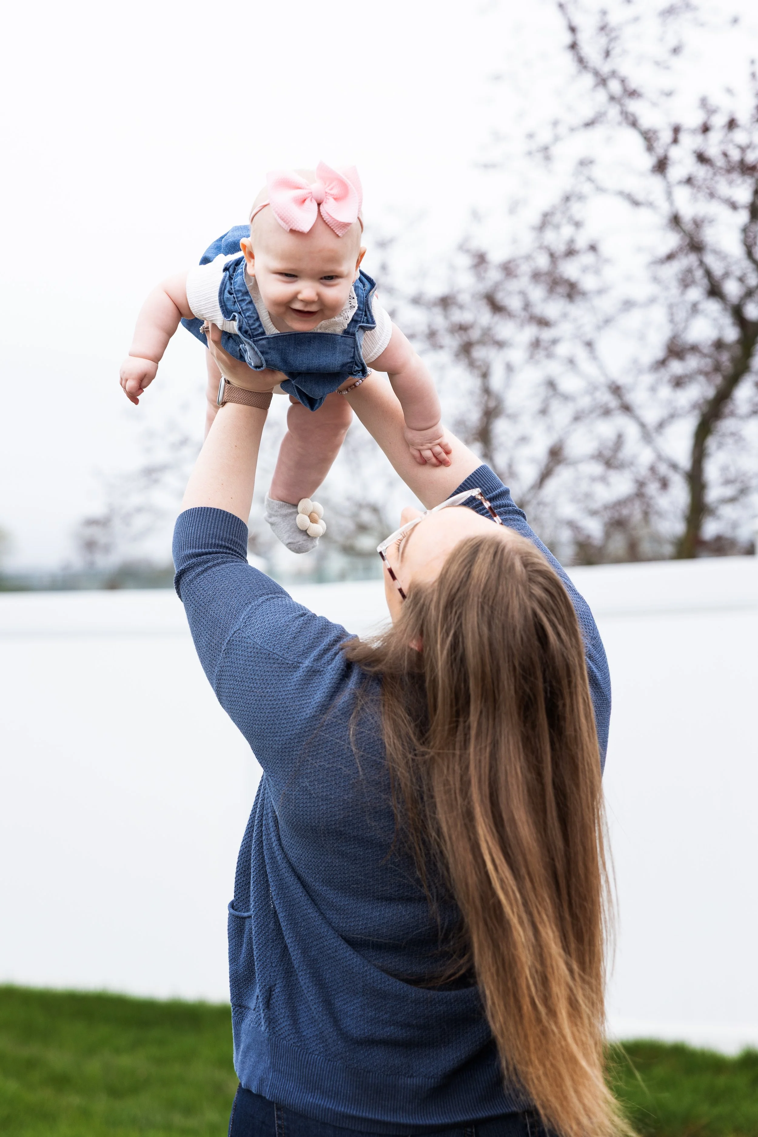 Mother lifting her baby
