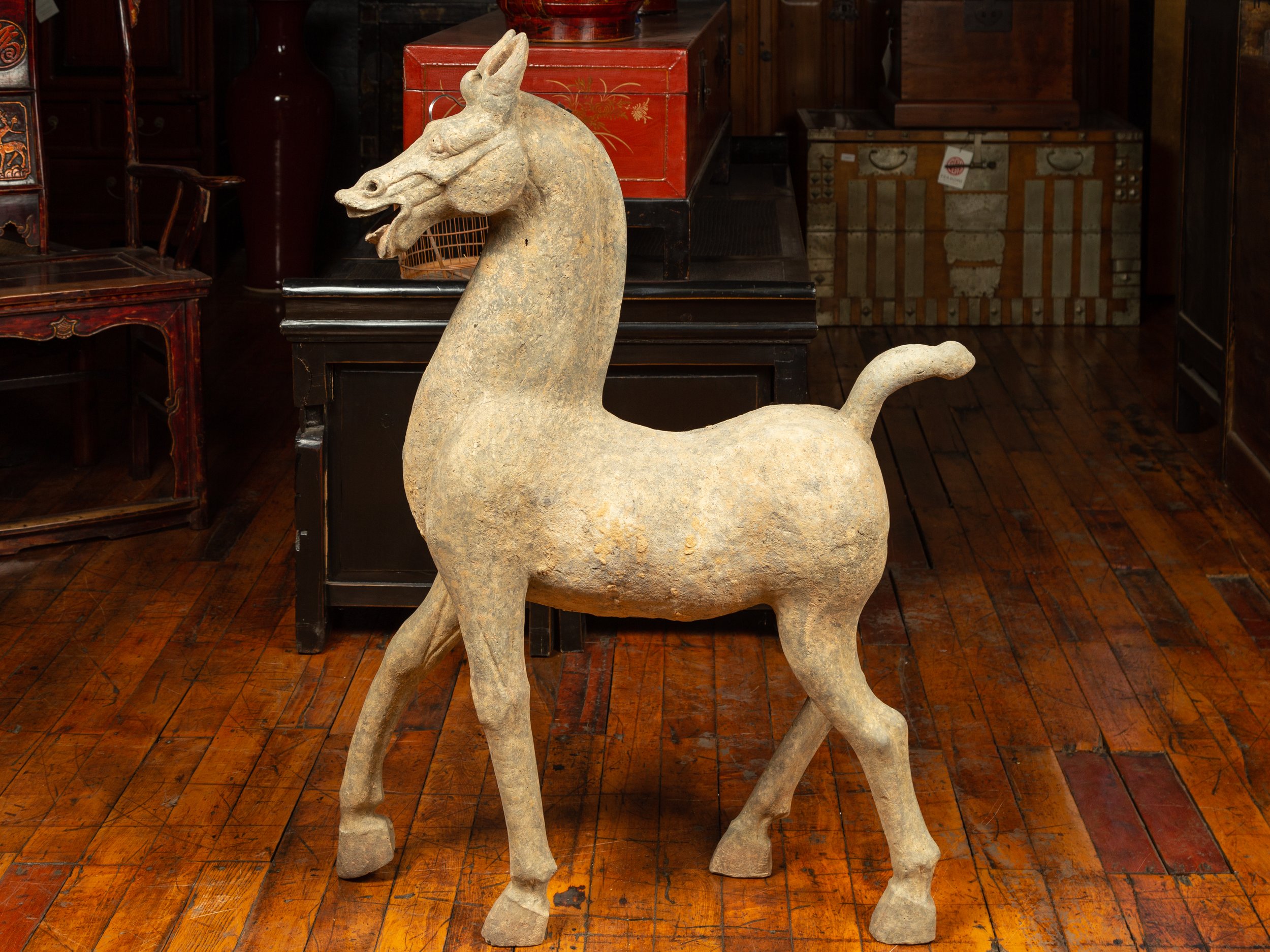 Horse sculpture photographed in an antiques gallery interior