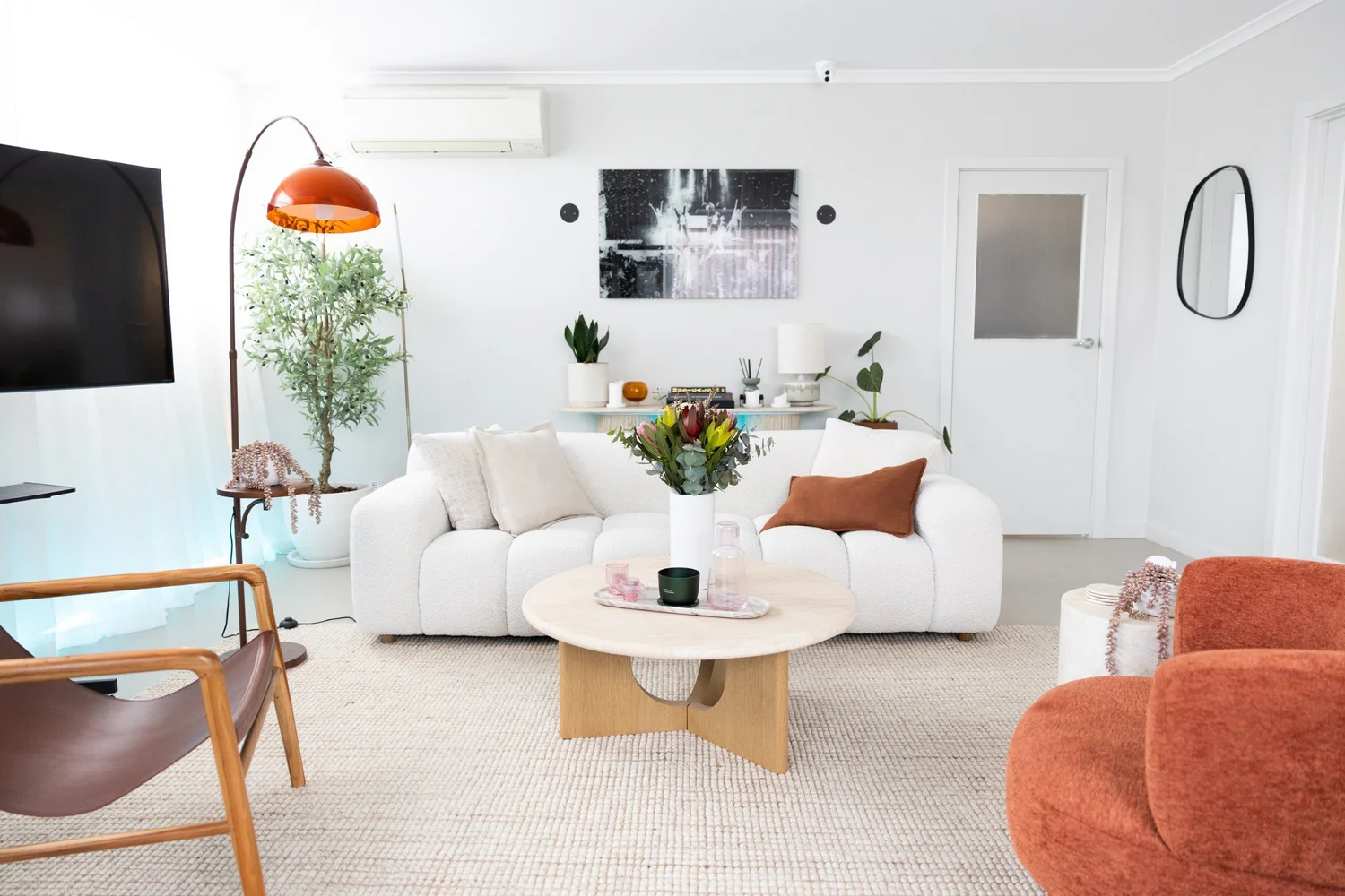 The client lounge at MSE HQ, white sofas and warm timber