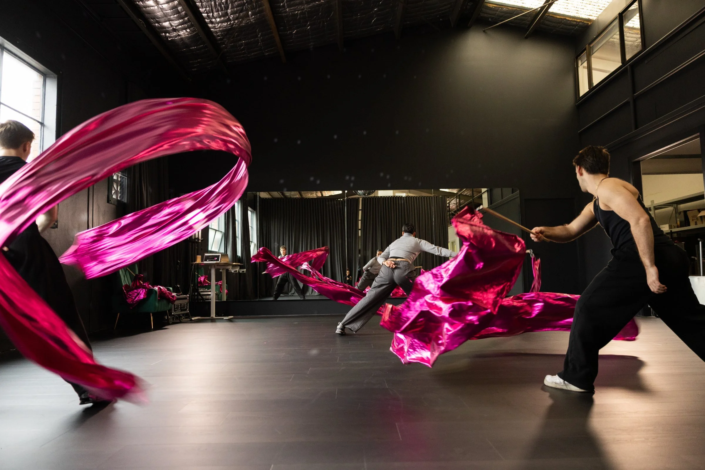 A performer rehearsing with sweeping magenta silk in the MSE HQ studio