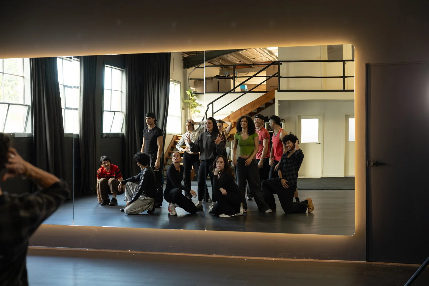 A cast reflected in the studio mirror wall at MSE HQ
