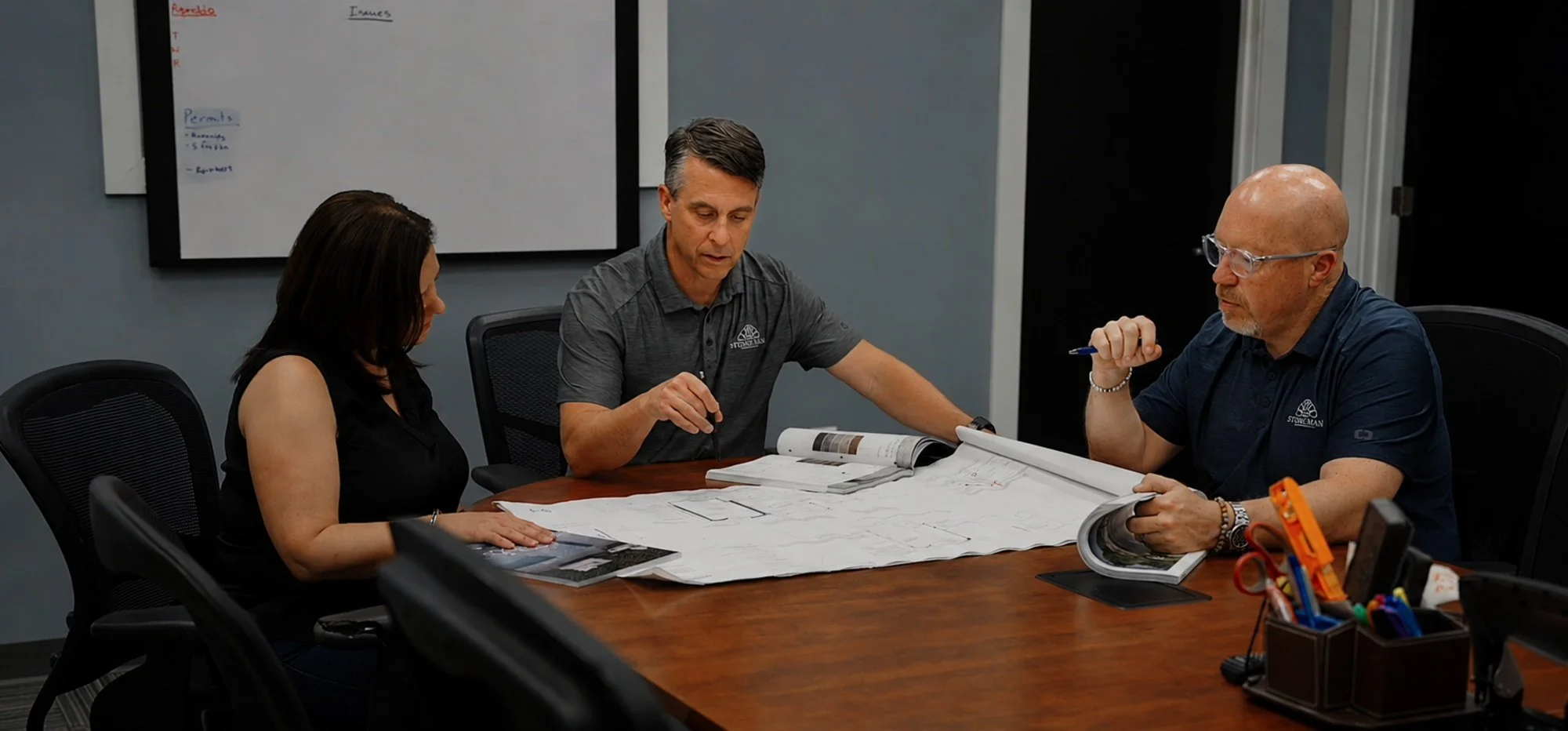 Multi-location landscape company leadership team planning operations and business growth with their landscape marketing agency