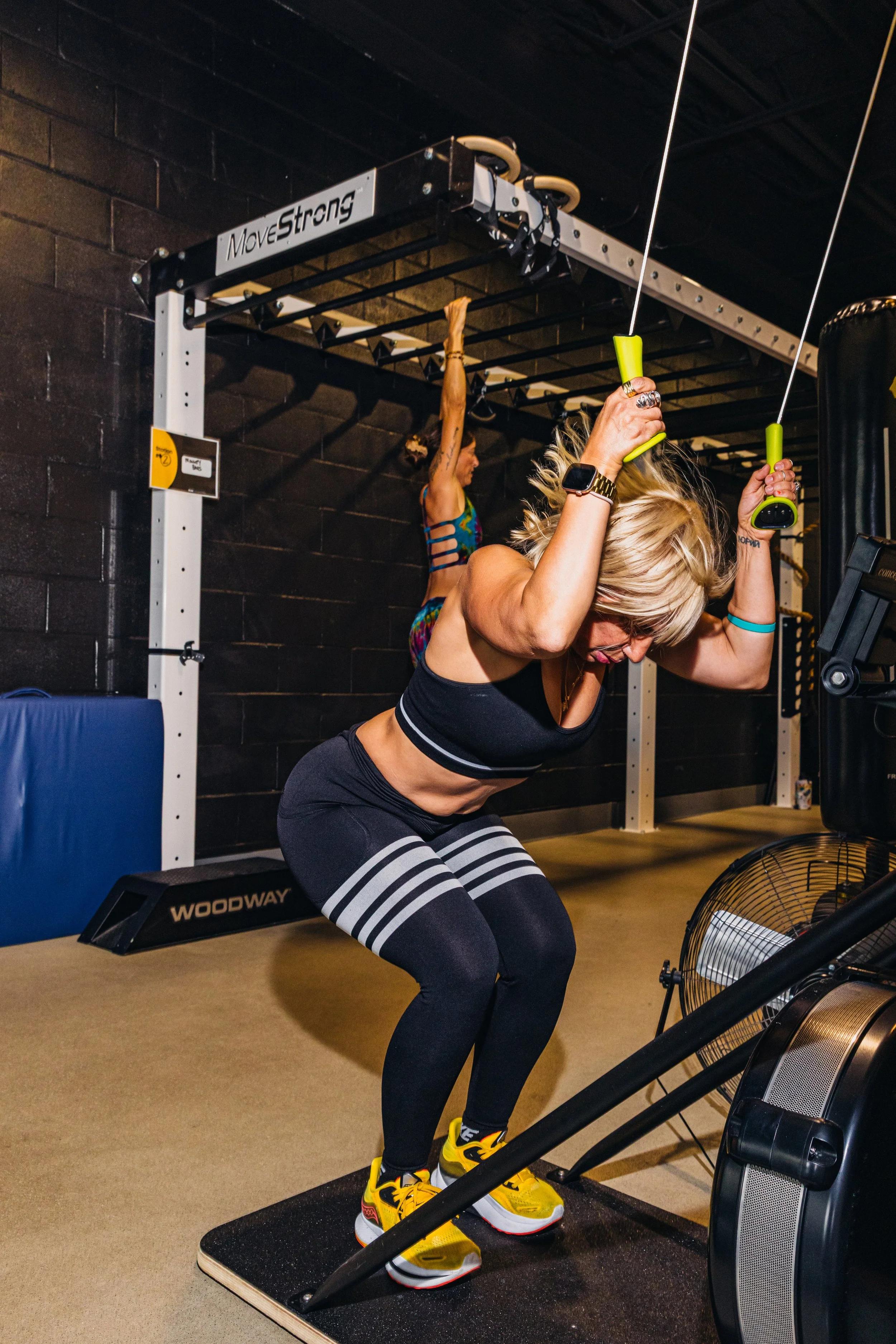 An athlete working a station at the rig, between run intervals.