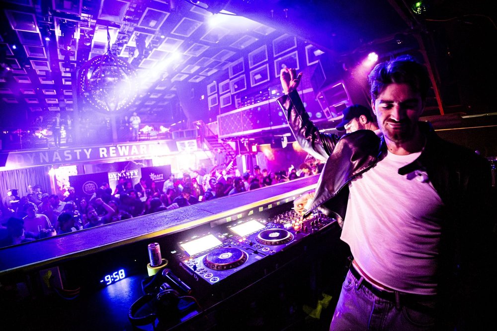 DJ performing to a packed club