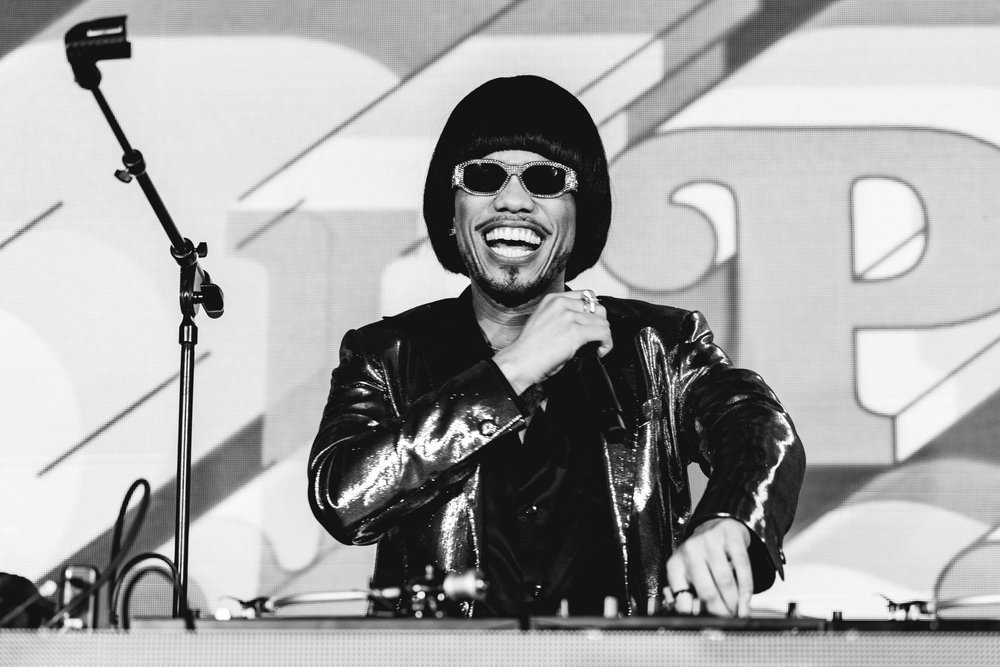 Black-and-white portrait of a DJ at the decks