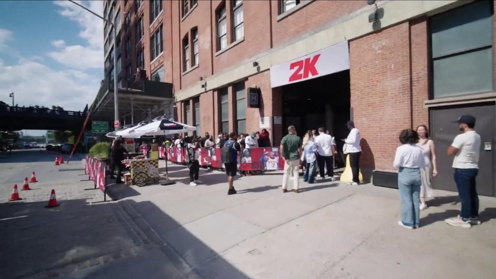 Crowd lining up outside a gaming brand house