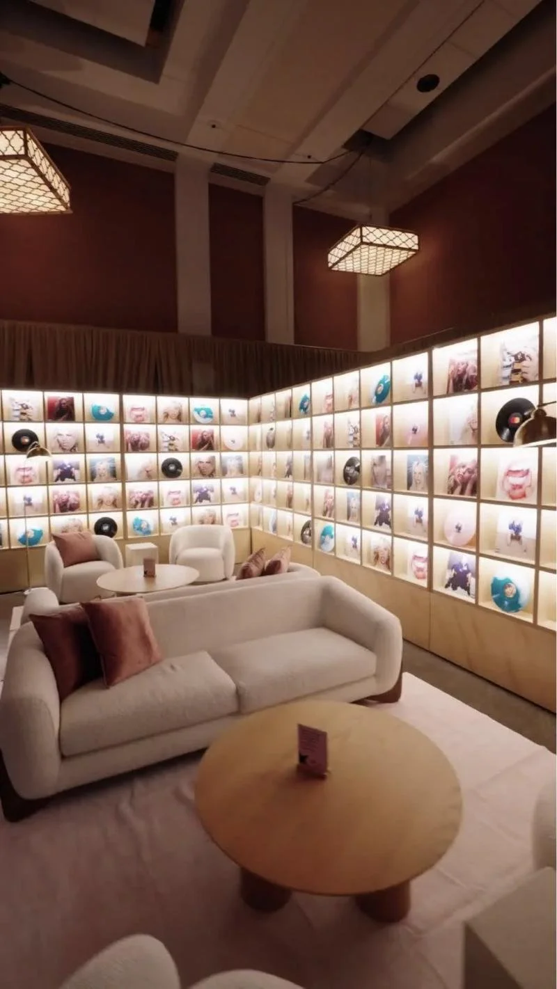 Lounge with a wall of illuminated vinyl records