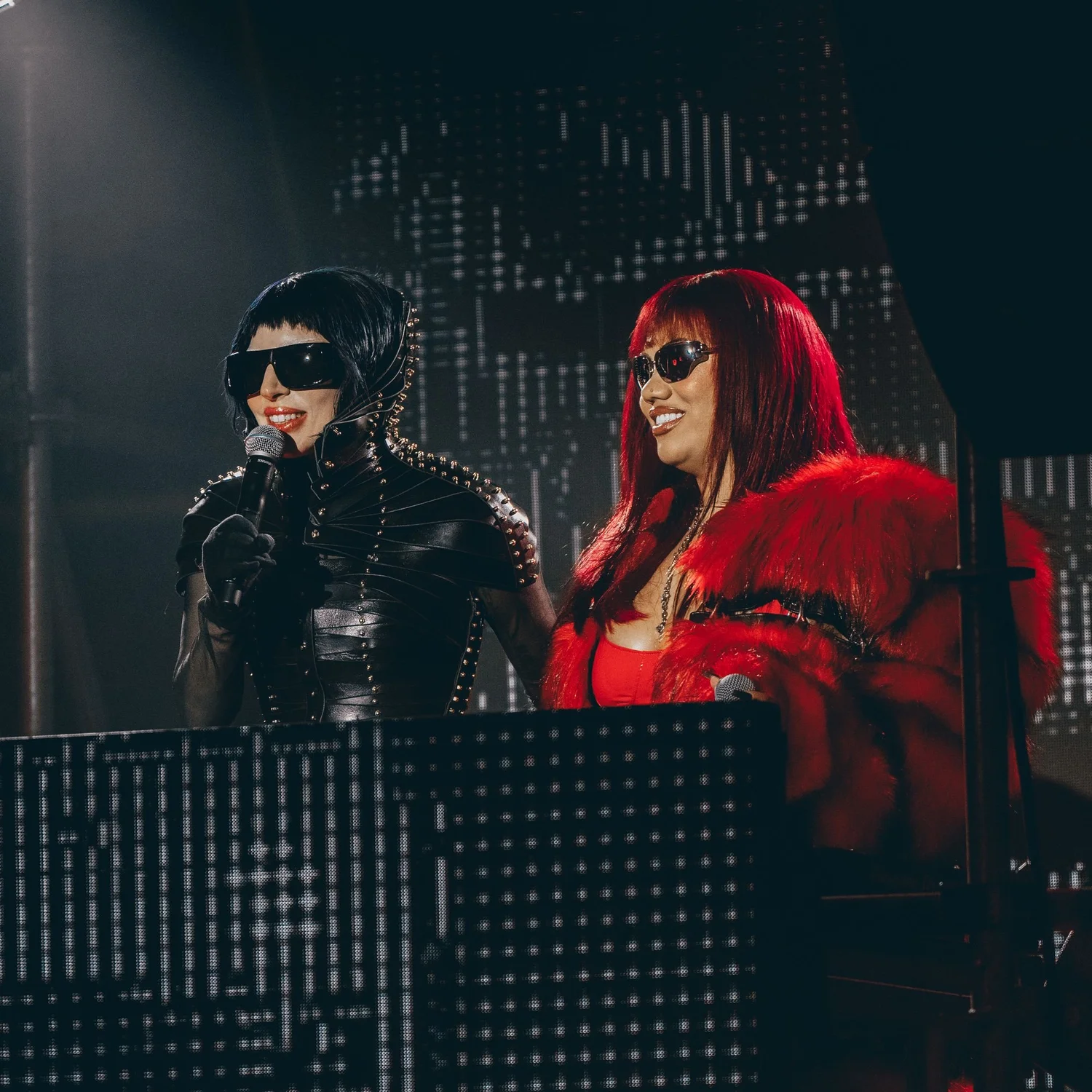 Performers on stage at a club night