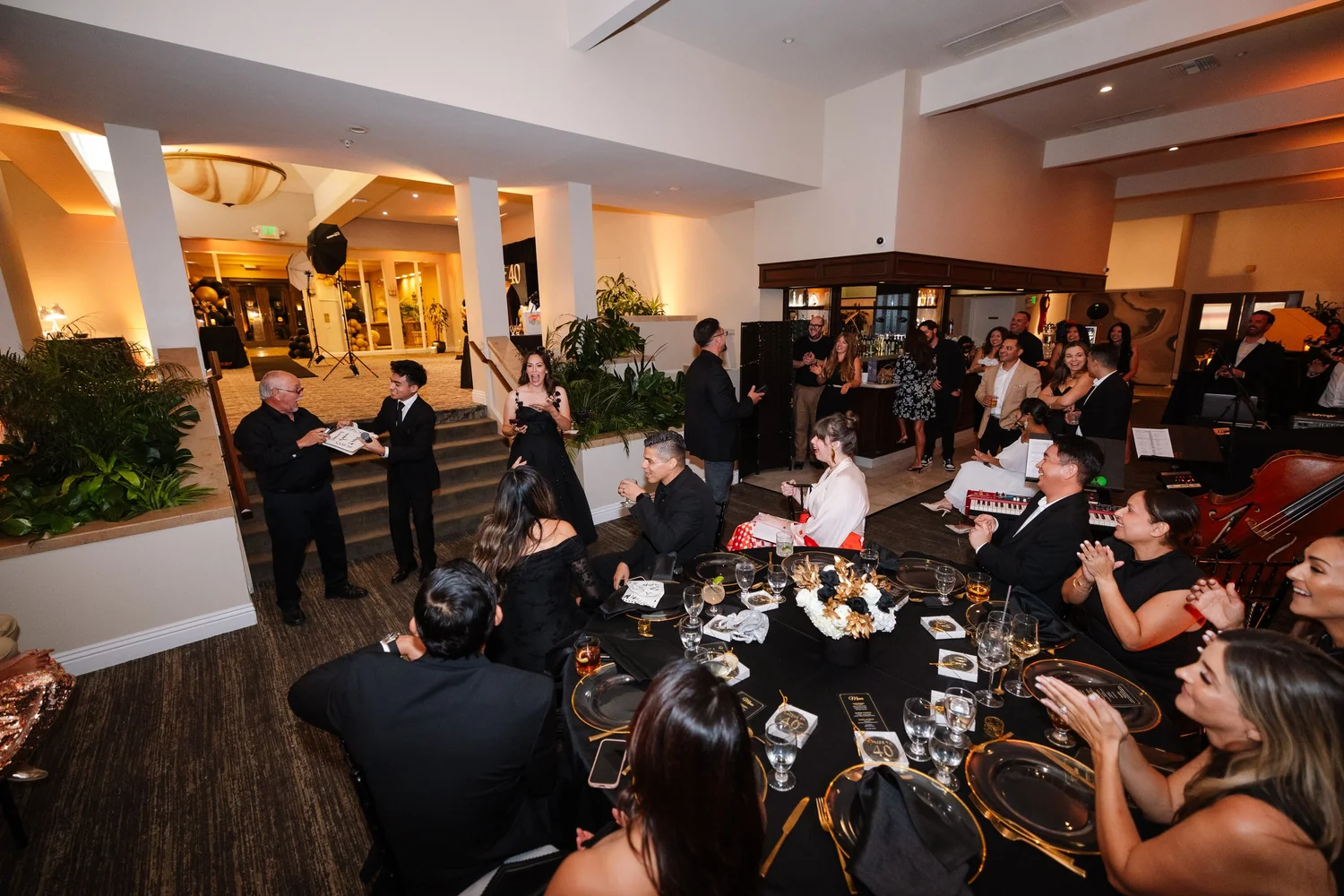 Jacob Martinez performing for seated dinner guests at a private party